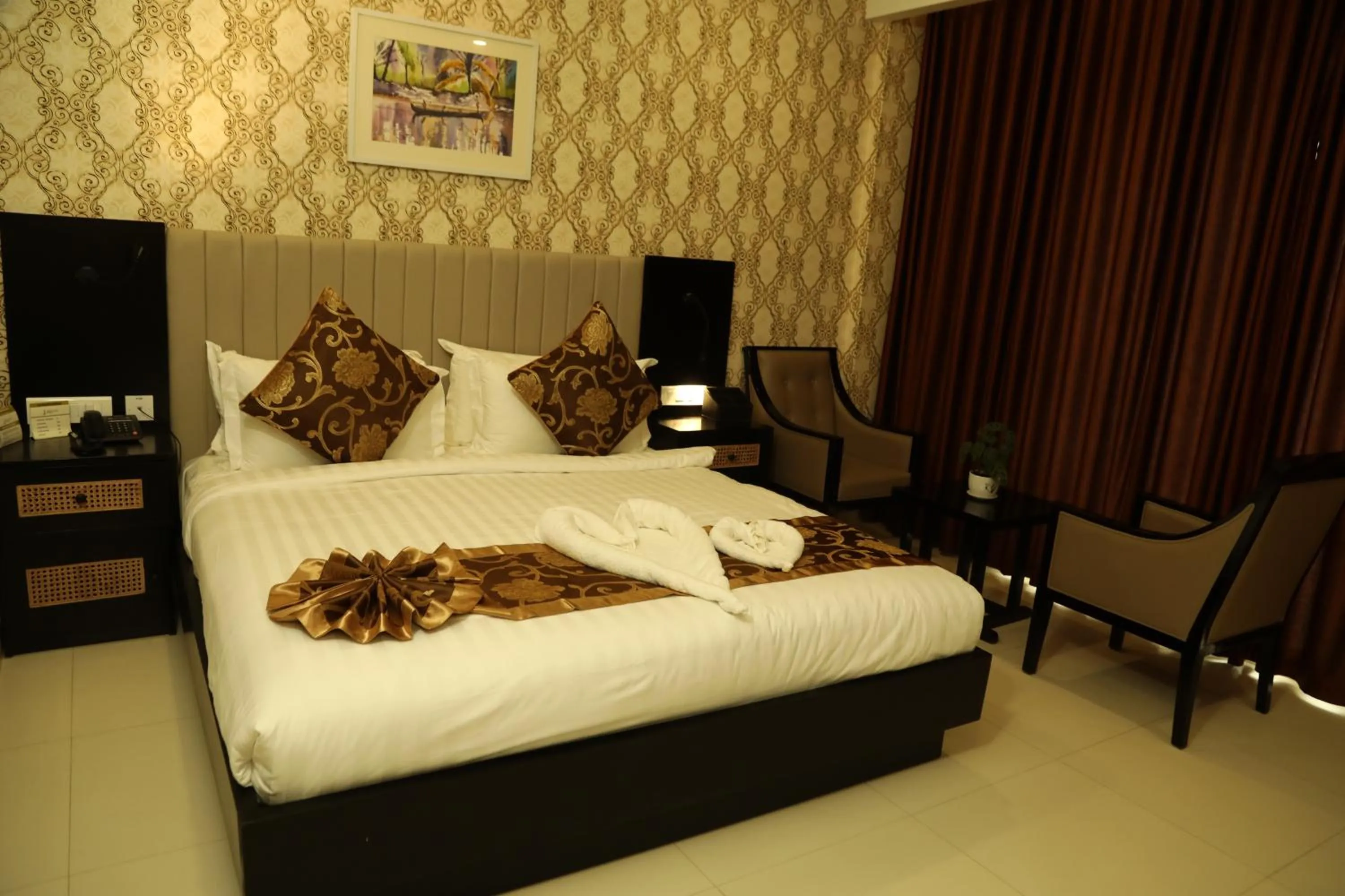 Bed in MARIYALAYAM MUNROE ISLAND RESIDENCY