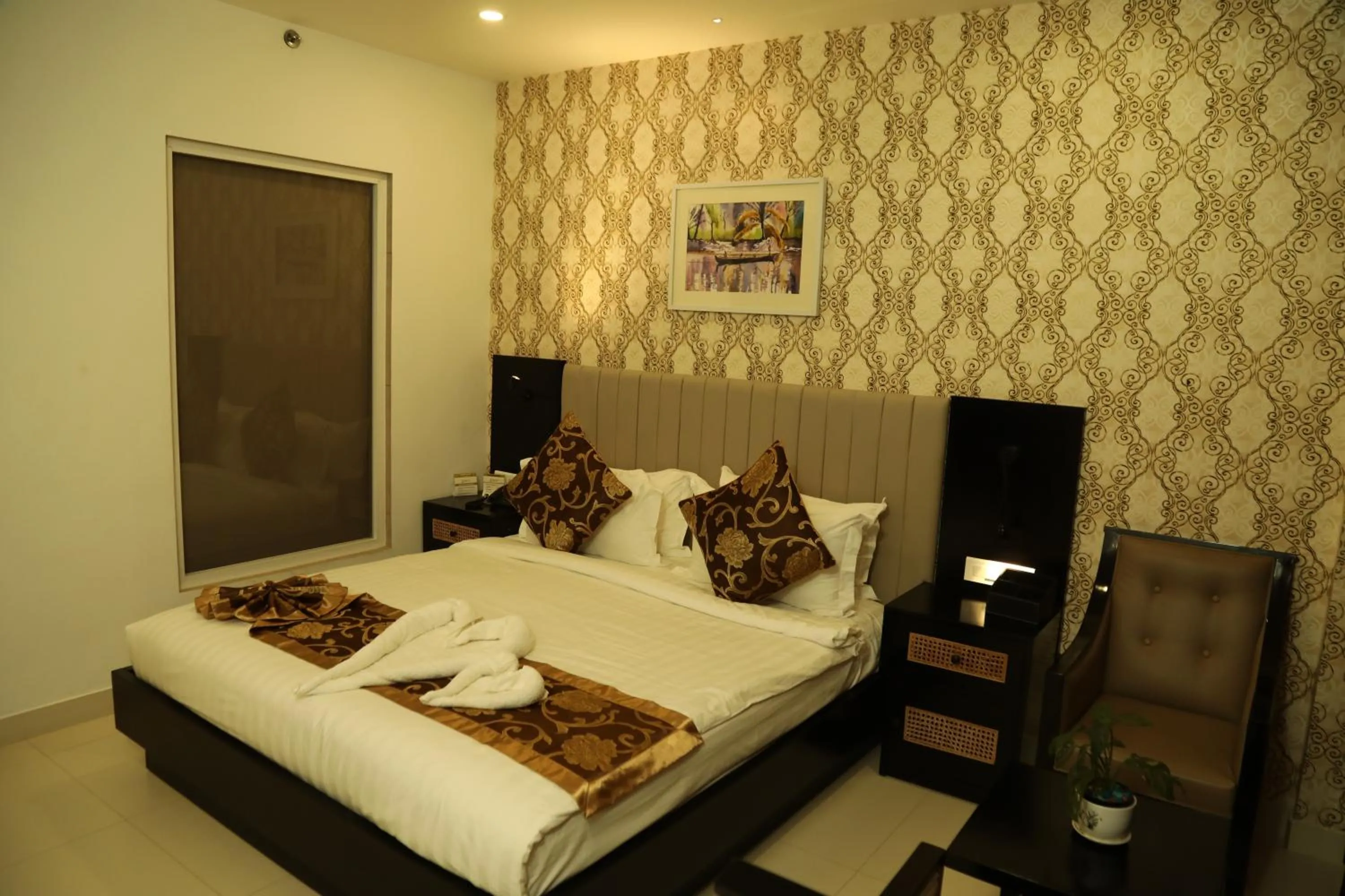 Bed in MARIYALAYAM MUNROE ISLAND RESIDENCY