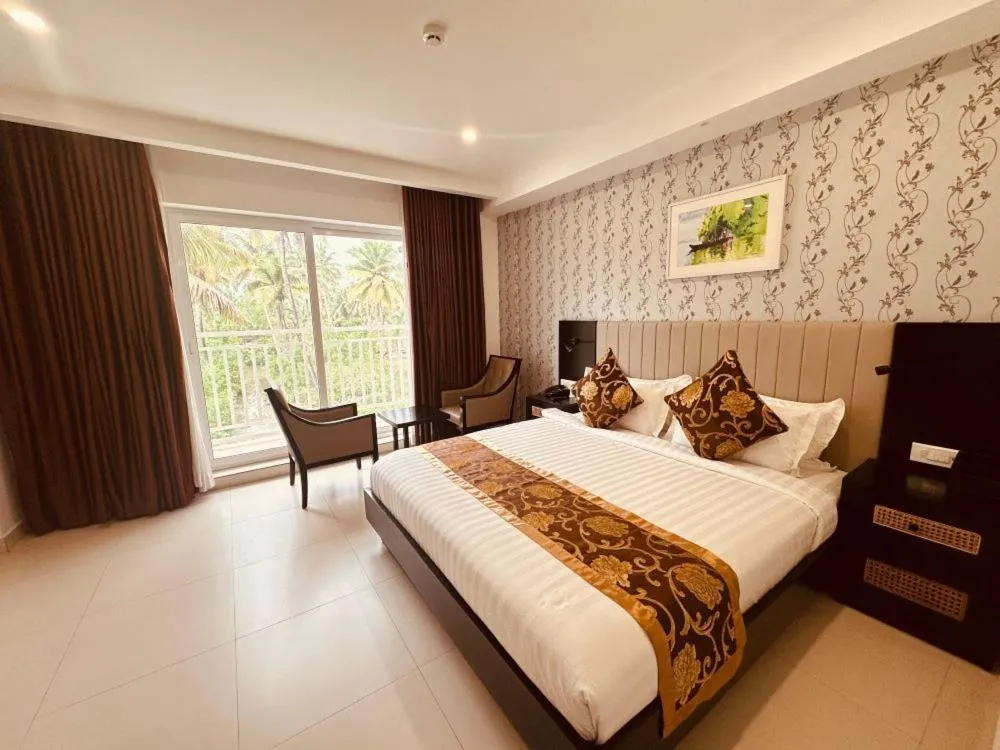 Bed in MARIYALAYAM MUNROE ISLAND RESIDENCY