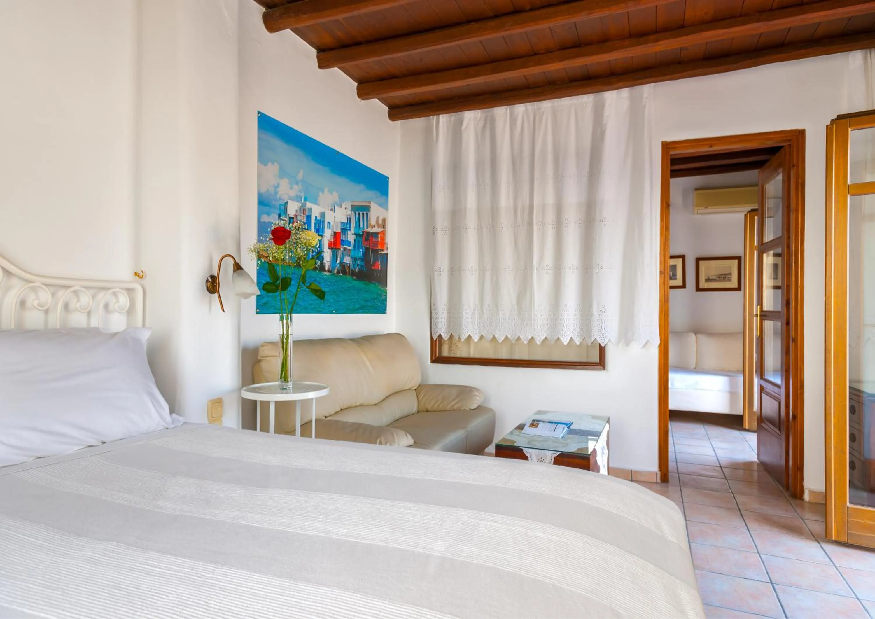 Living room, Bed in Paradision Hotel