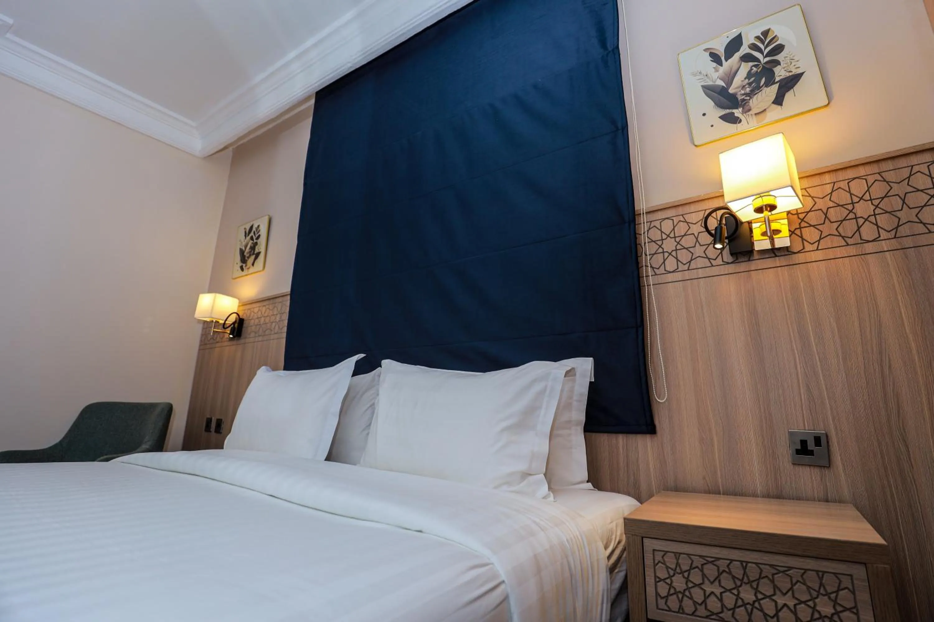 Bed in Nawazi Towers Hotel