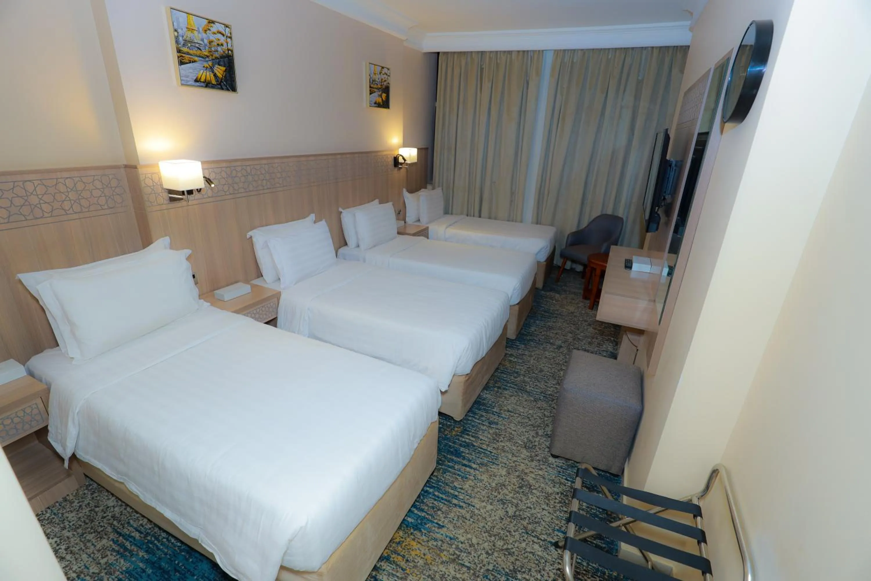 Bed in Nawazi Towers Hotel