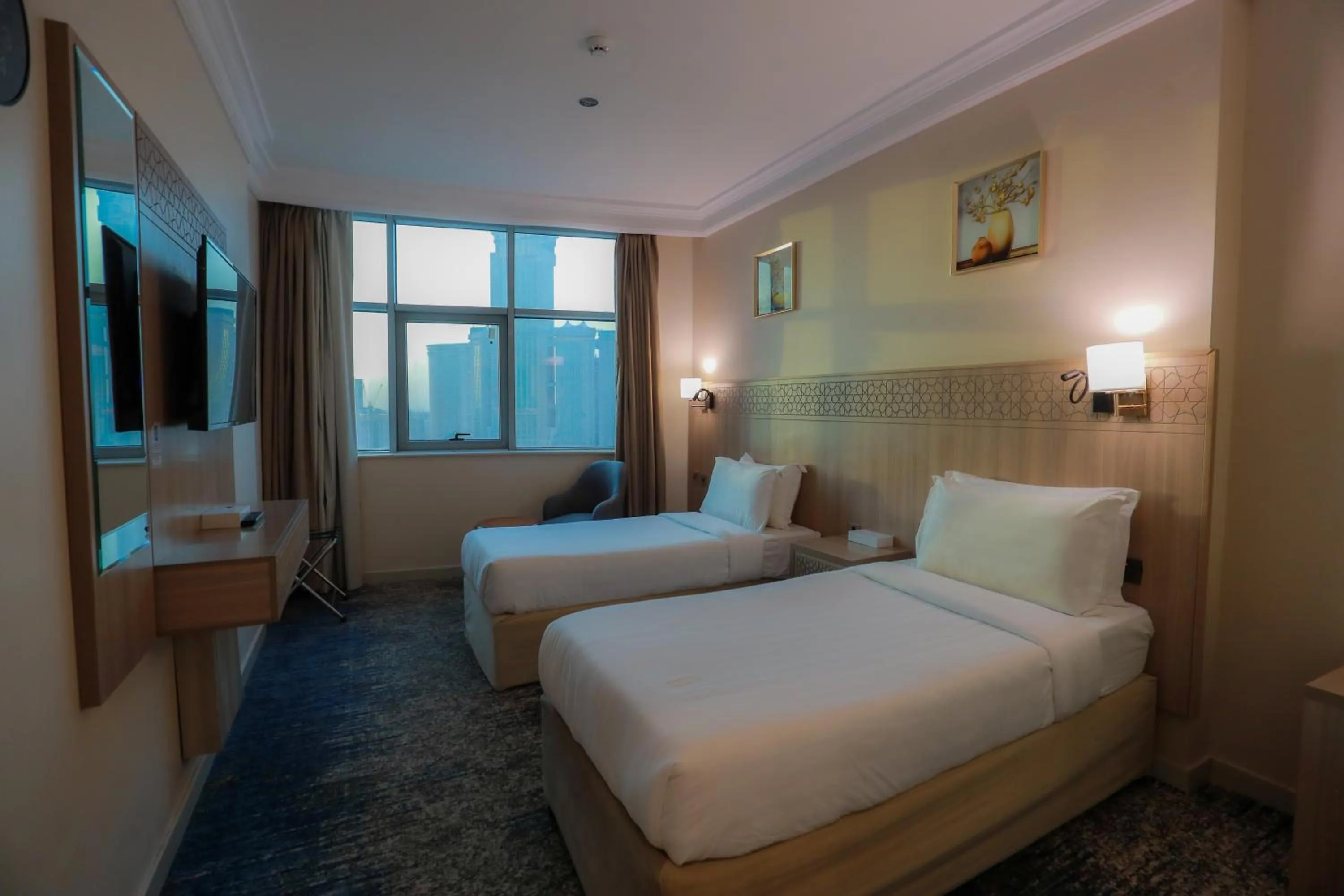 Bed in Nawazi Towers Hotel