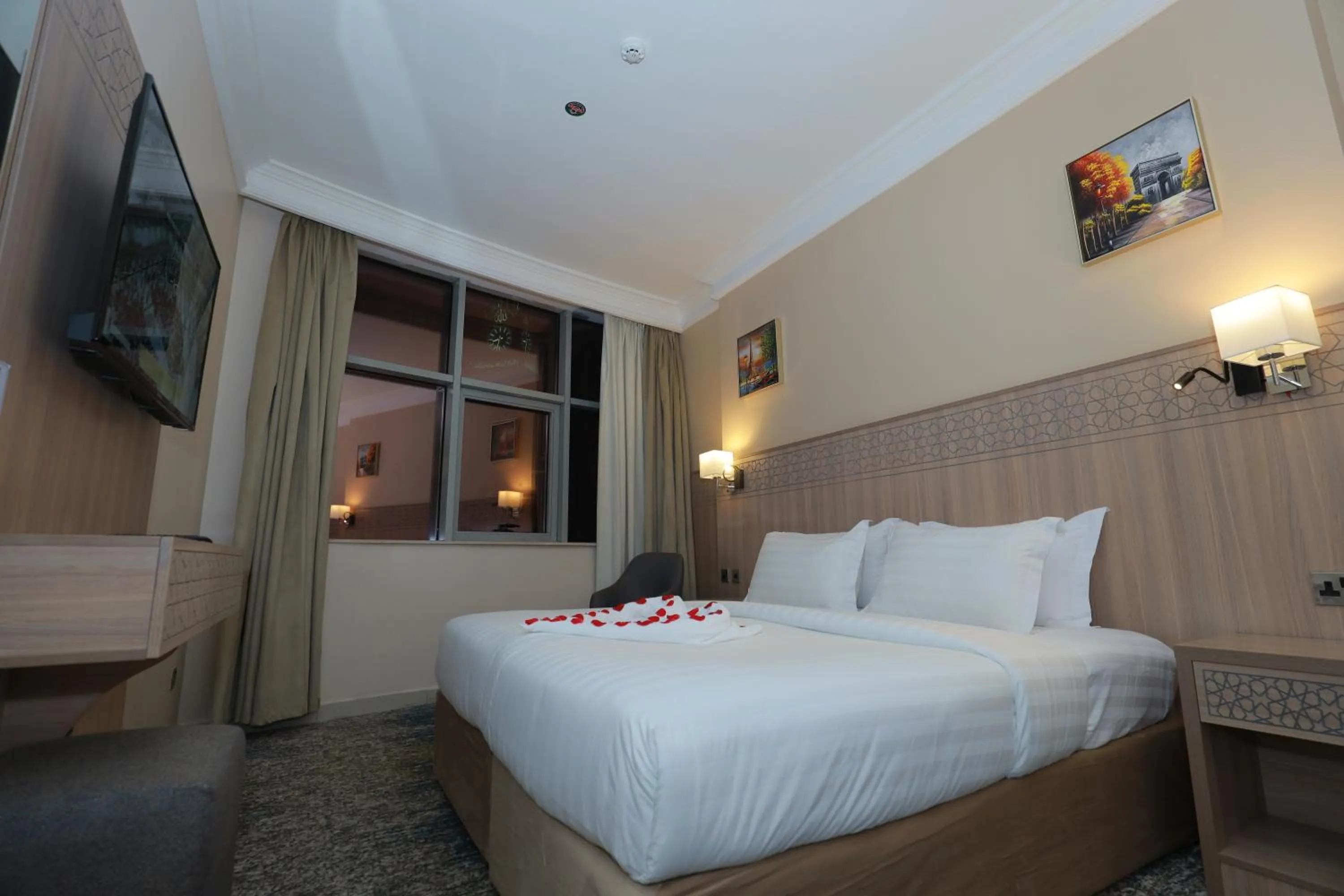 Bed in Nawazi Towers Hotel