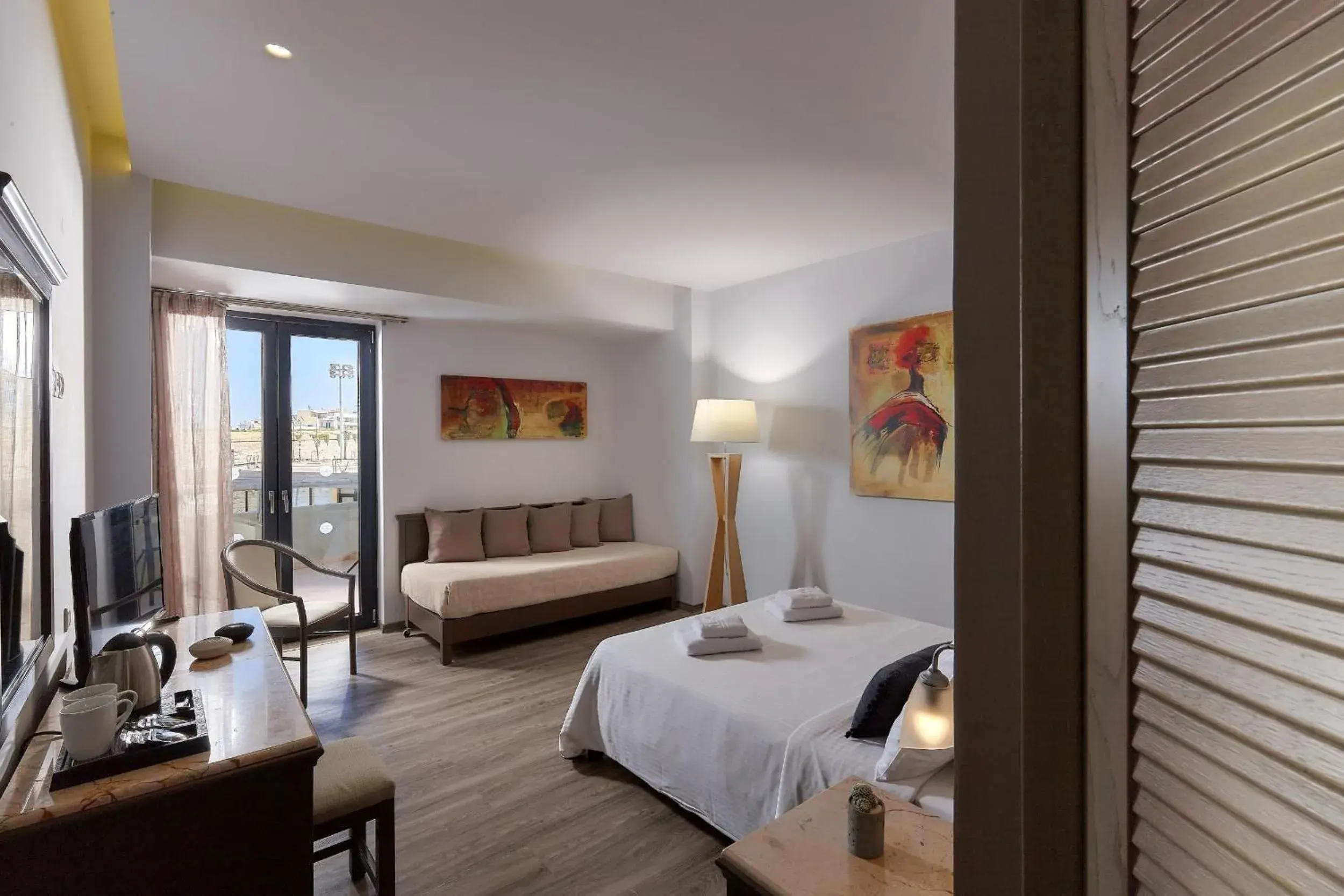 Deluxe Triple Room in Castello City Hotel Deluxe Triple Room in Castello City Hotel