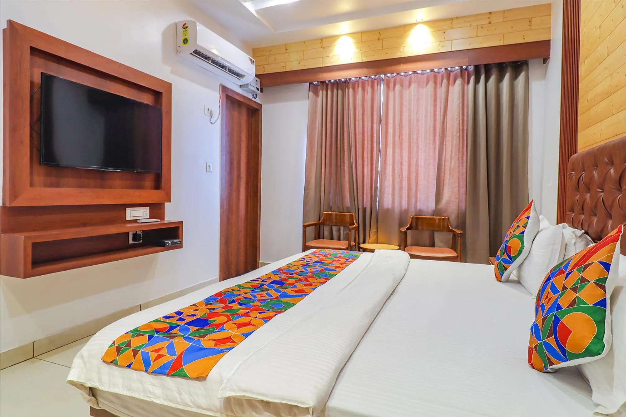 Bed in FabHotel Grand Arya
