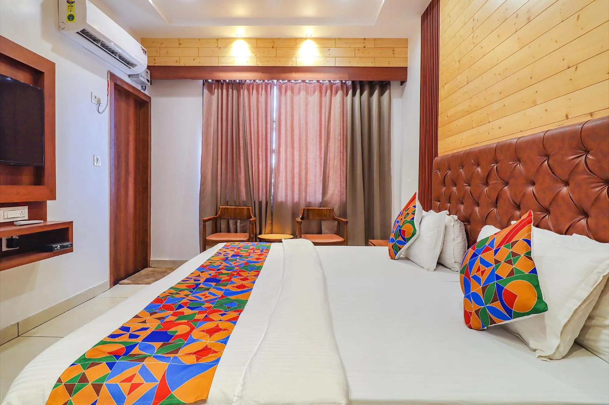 Bed in FabHotel Grand Arya