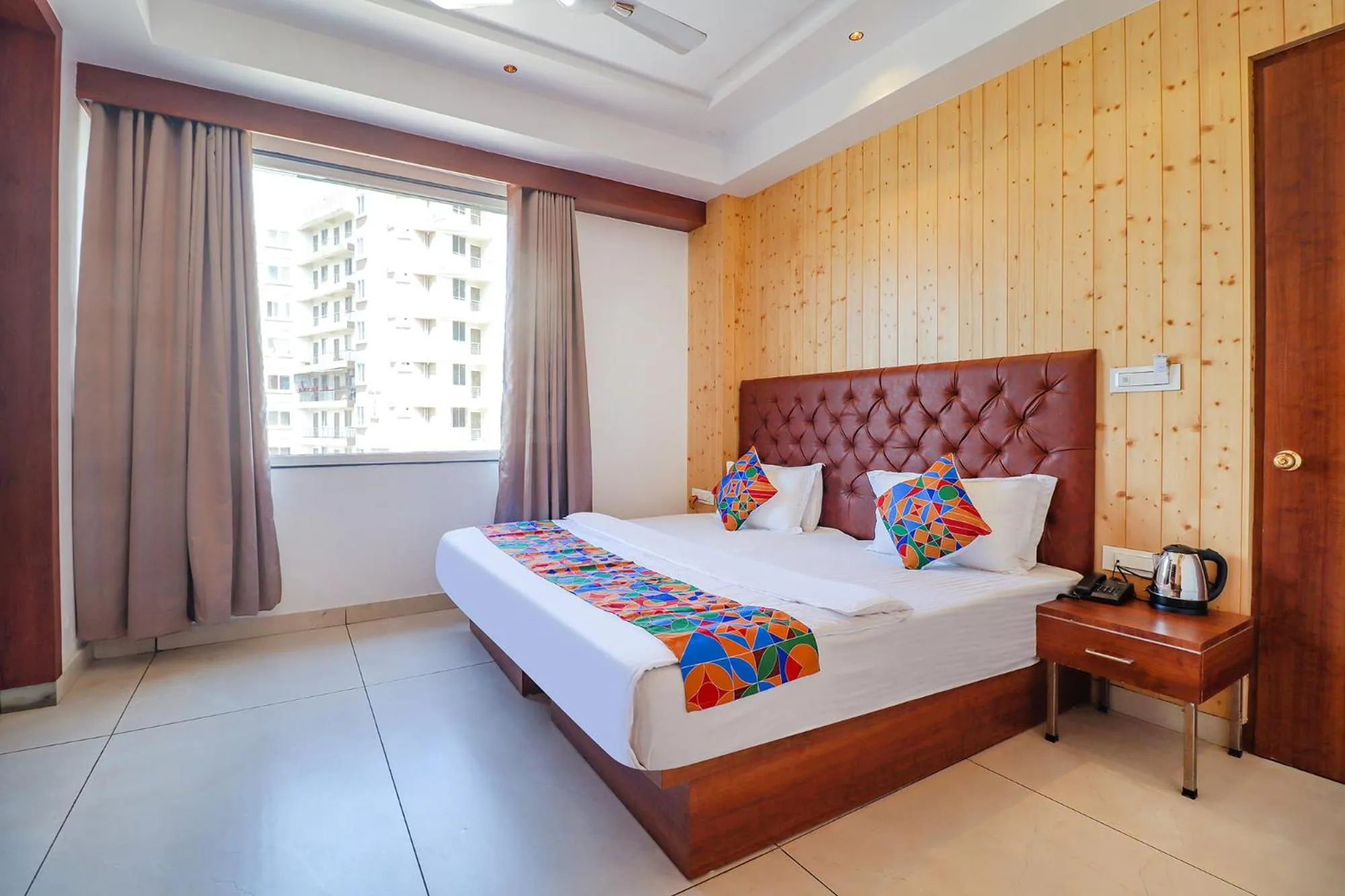 Bed in FabHotel Grand Arya