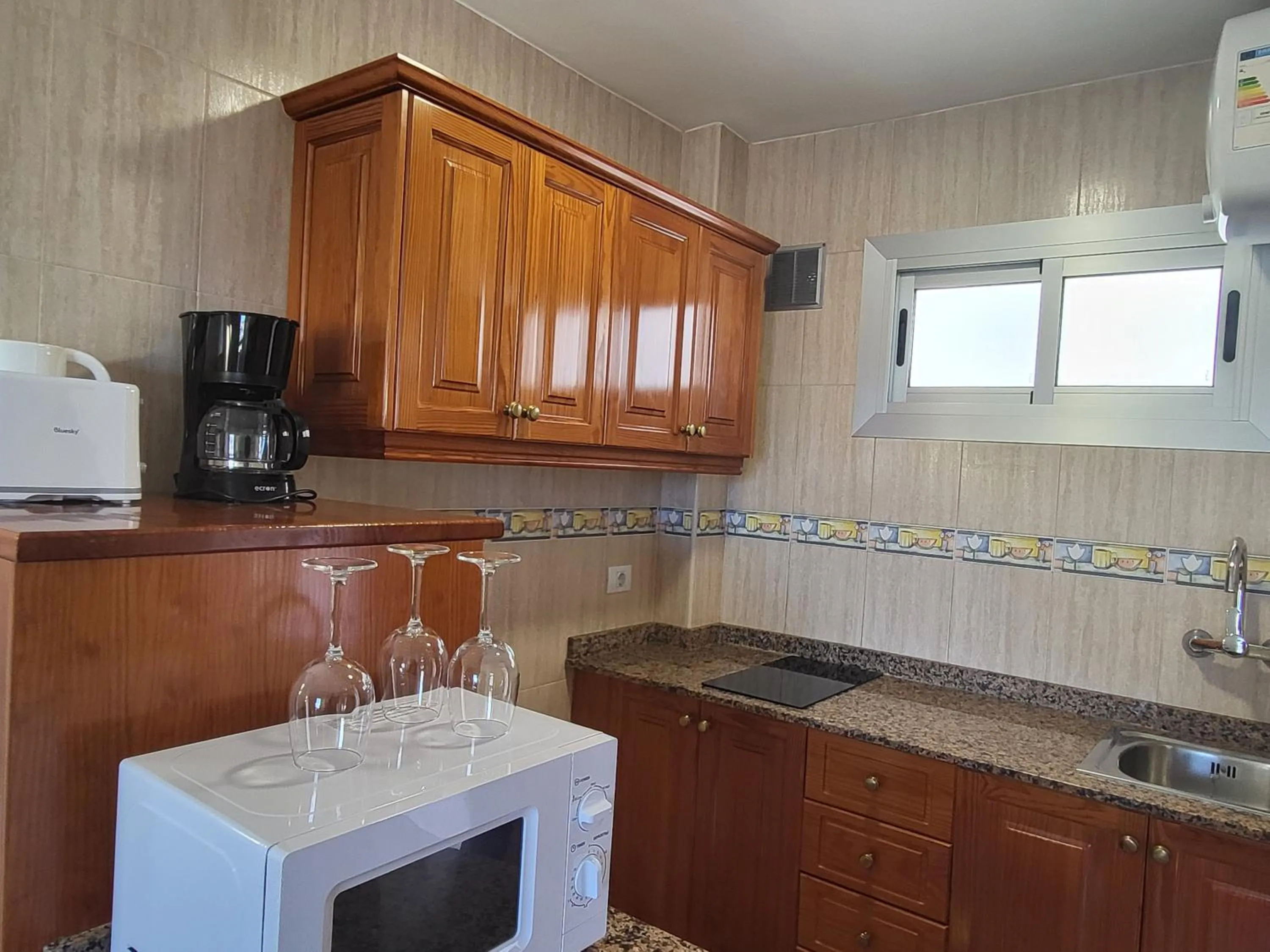 Kitchen or kitchenette in Las Camelias Apartments