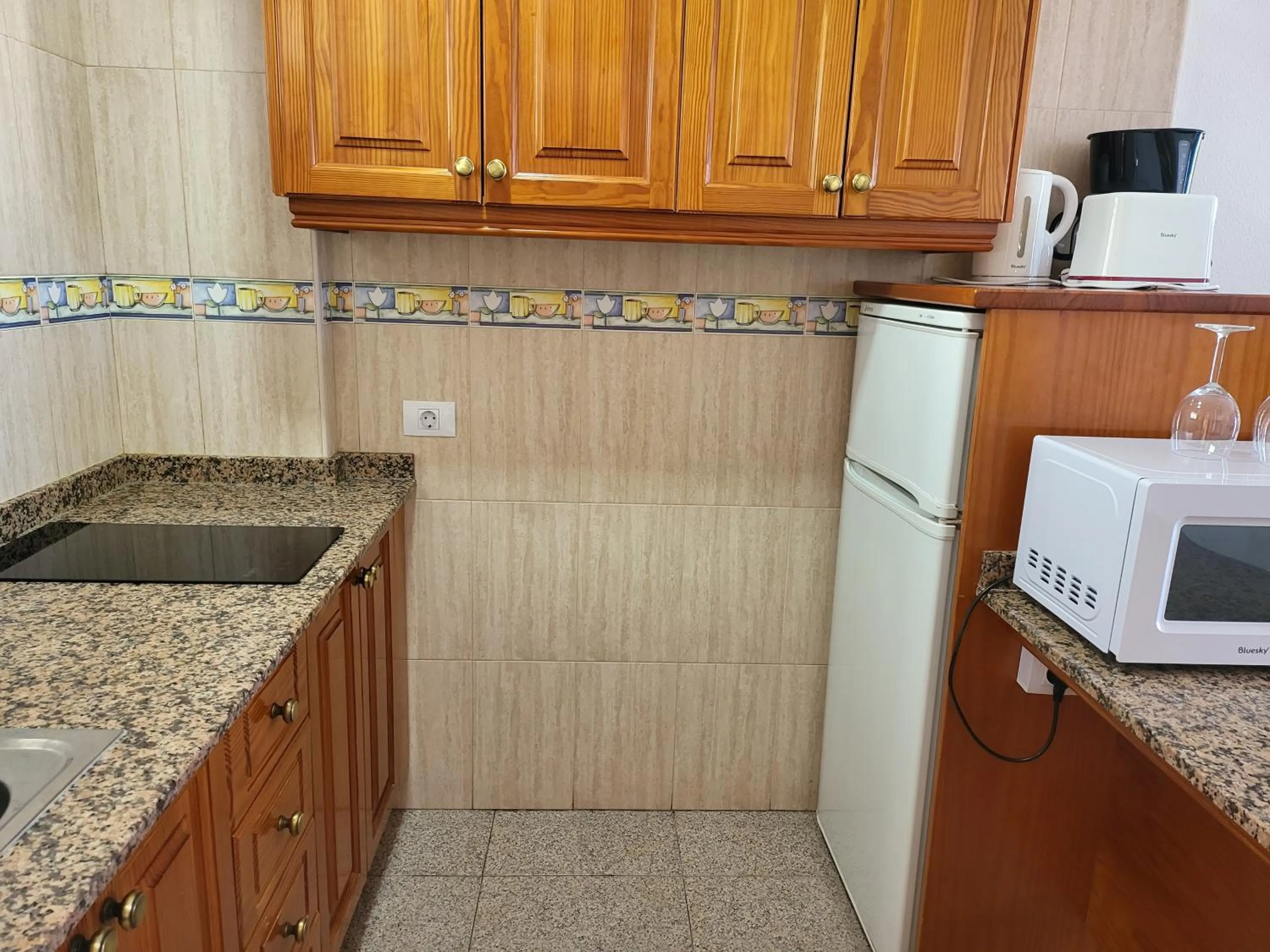 Kitchen or kitchenette in Las Camelias Apartments