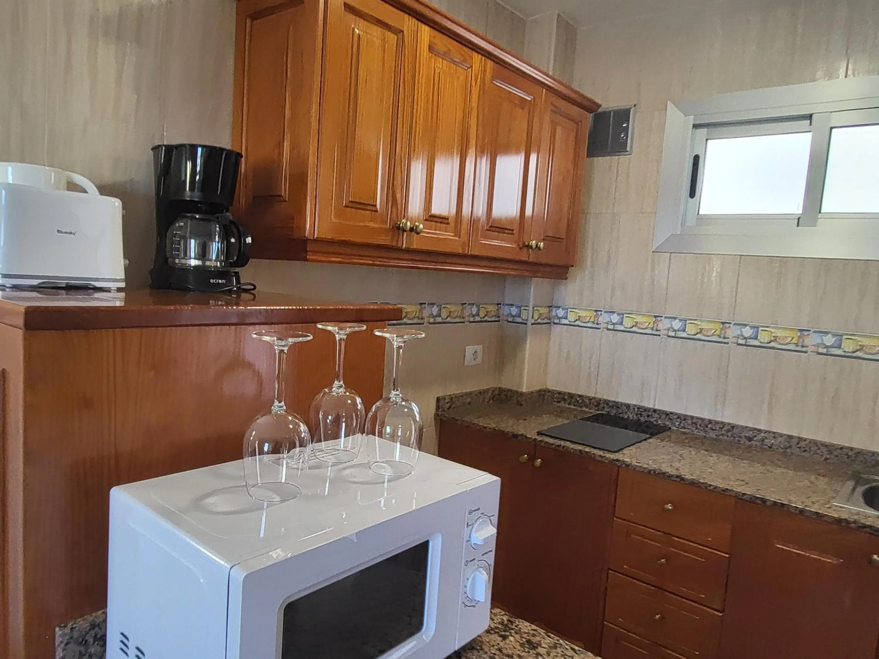 Kitchen or kitchenette in Las Camelias Apartments