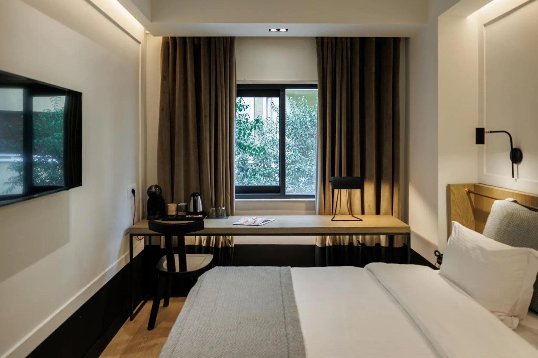 Bed in Niki Athens Hotel