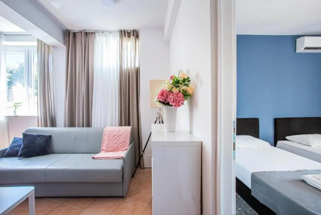 Seating area, Bed in Hotel Lumbarda