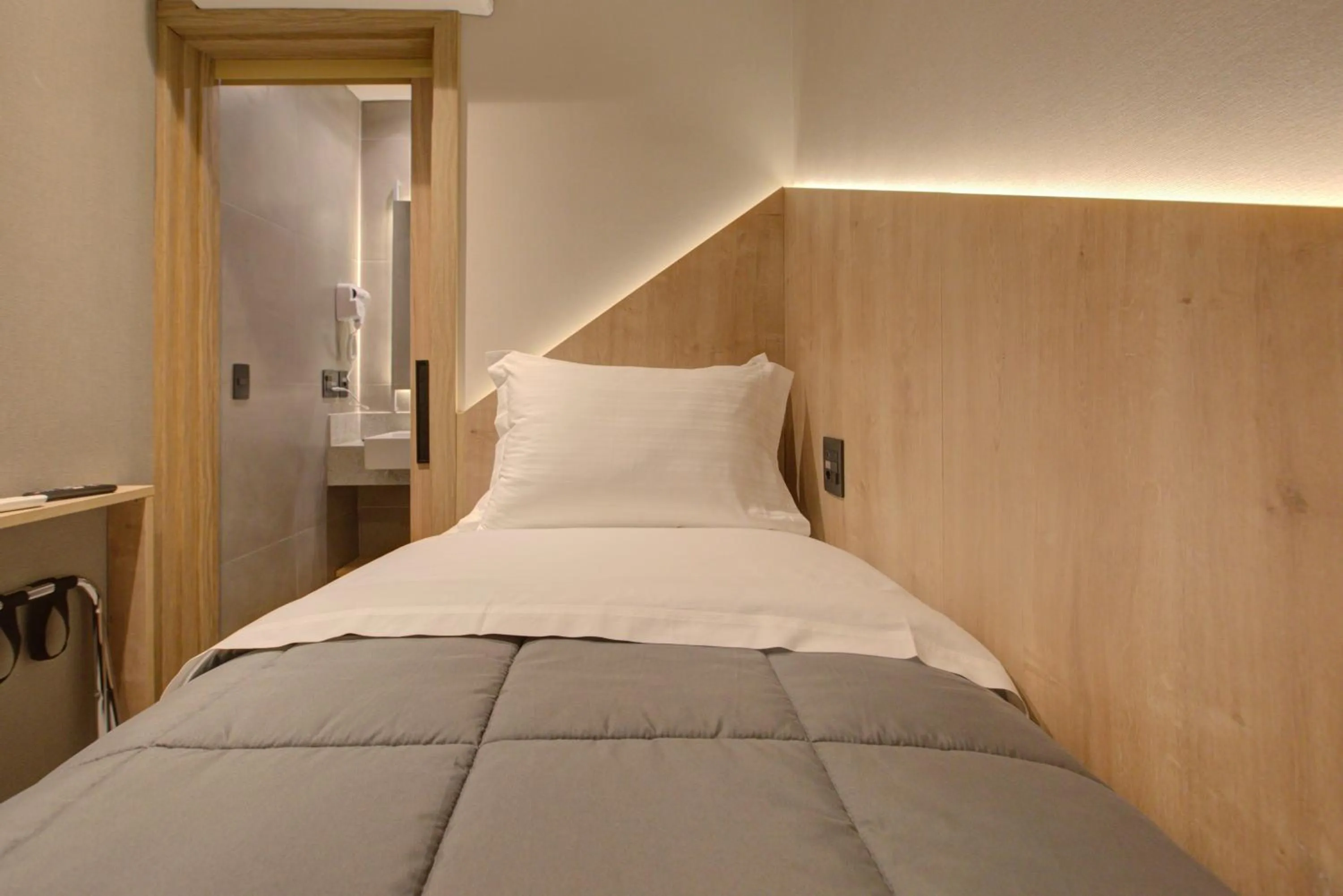 Bed in Fast Sleep Suites by Slaviero Hoteis - Hotel dentro do Aeroporto de Guarulhos - Terminal 2 - desembarque oeste