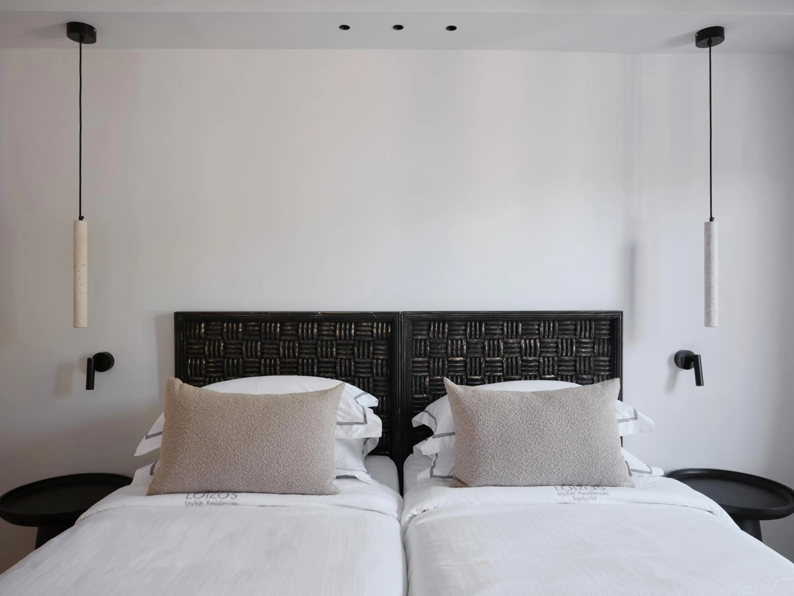 Bed in Loizos Stylish Residences