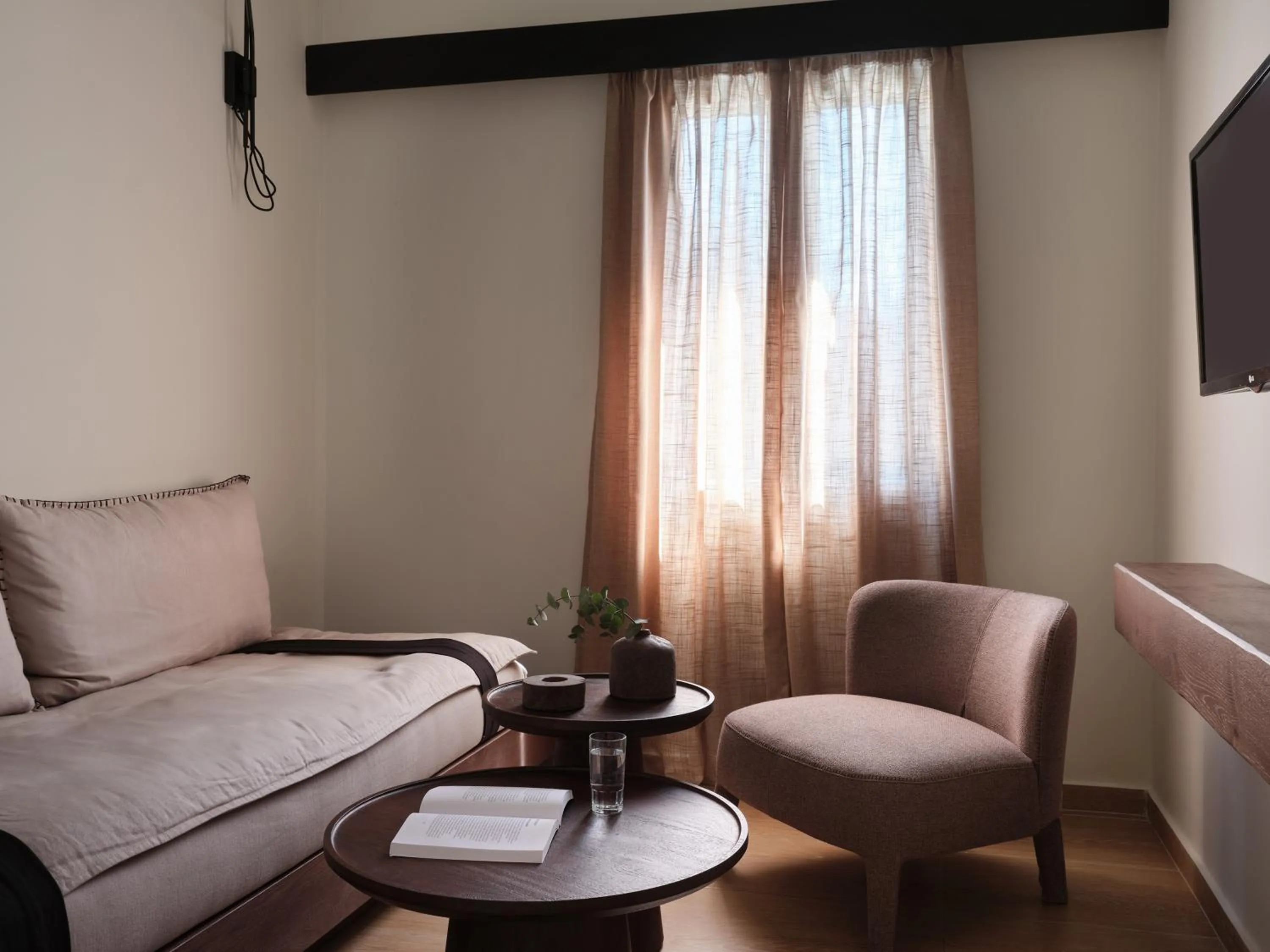 Seating area in Loizos Stylish Residences