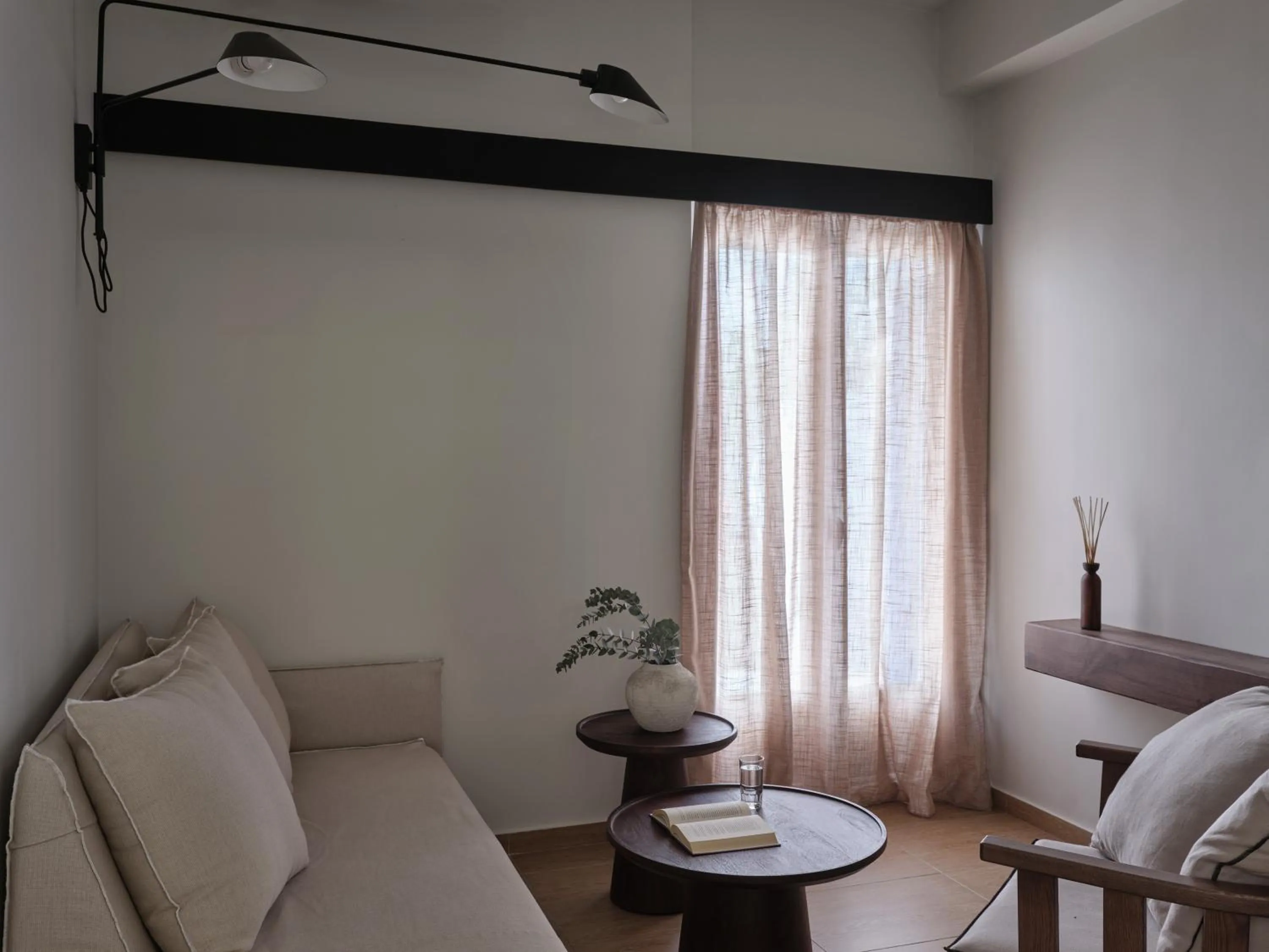 Seating area in Loizos Stylish Residences