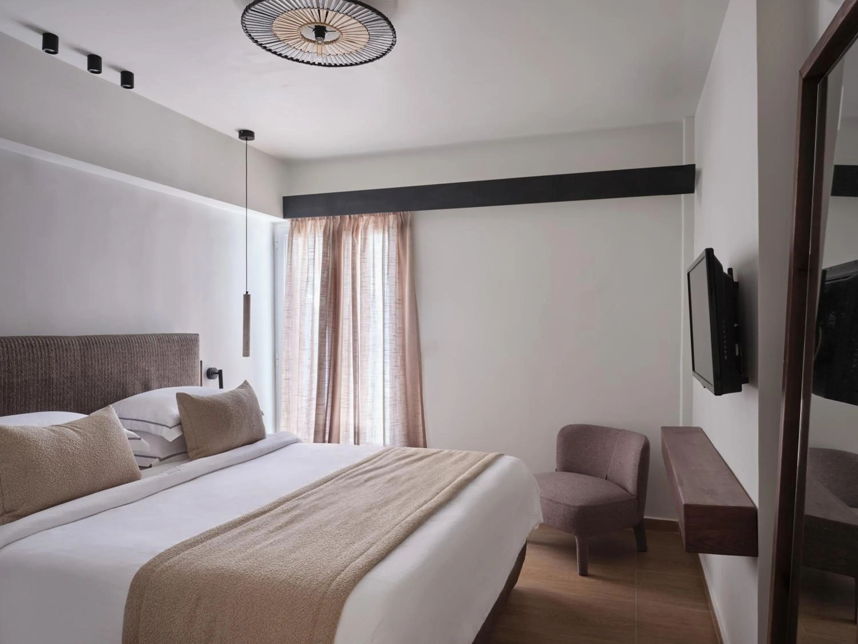 Bed in Loizos Stylish Residences