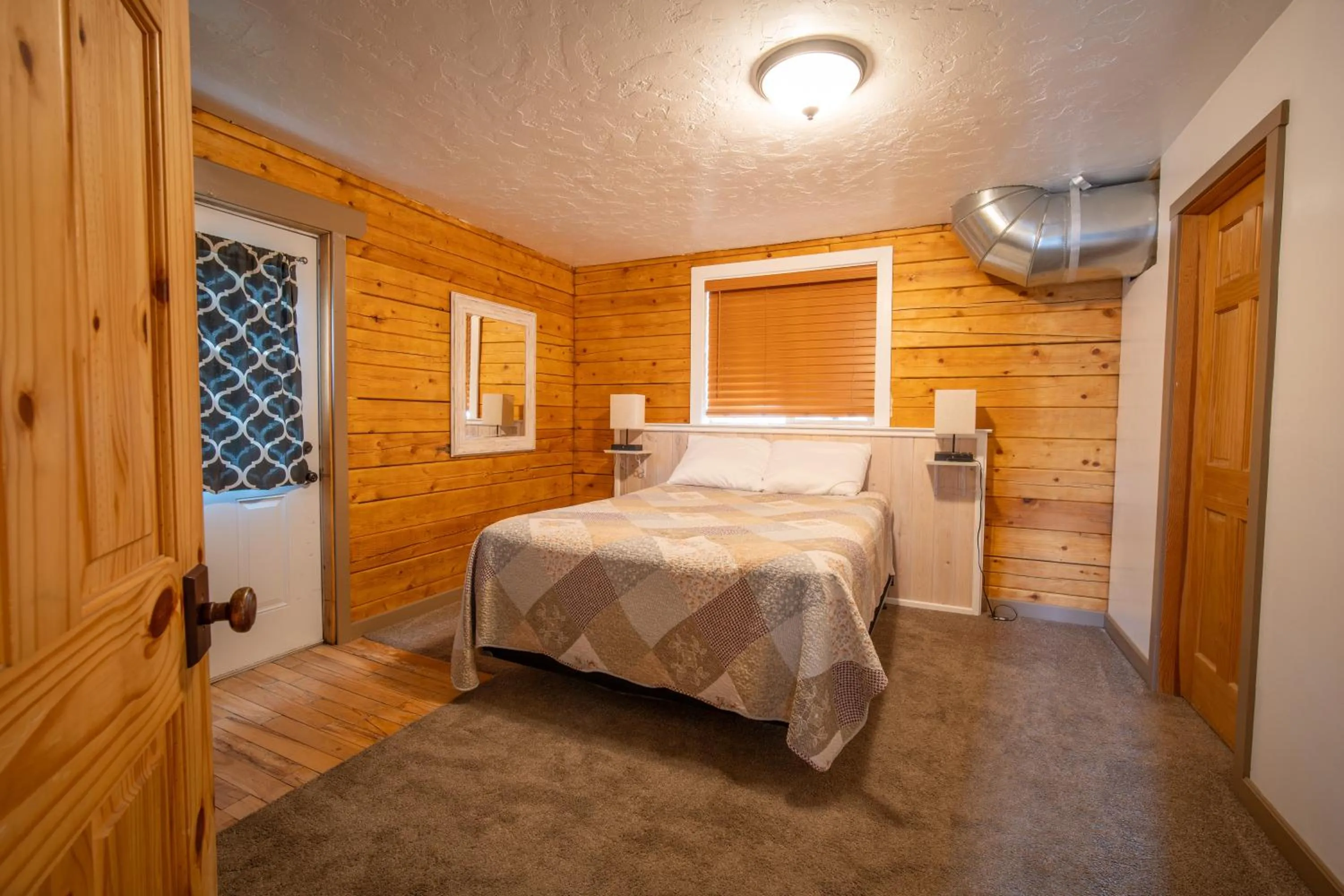 Bed in Alpine Lodge Hotel