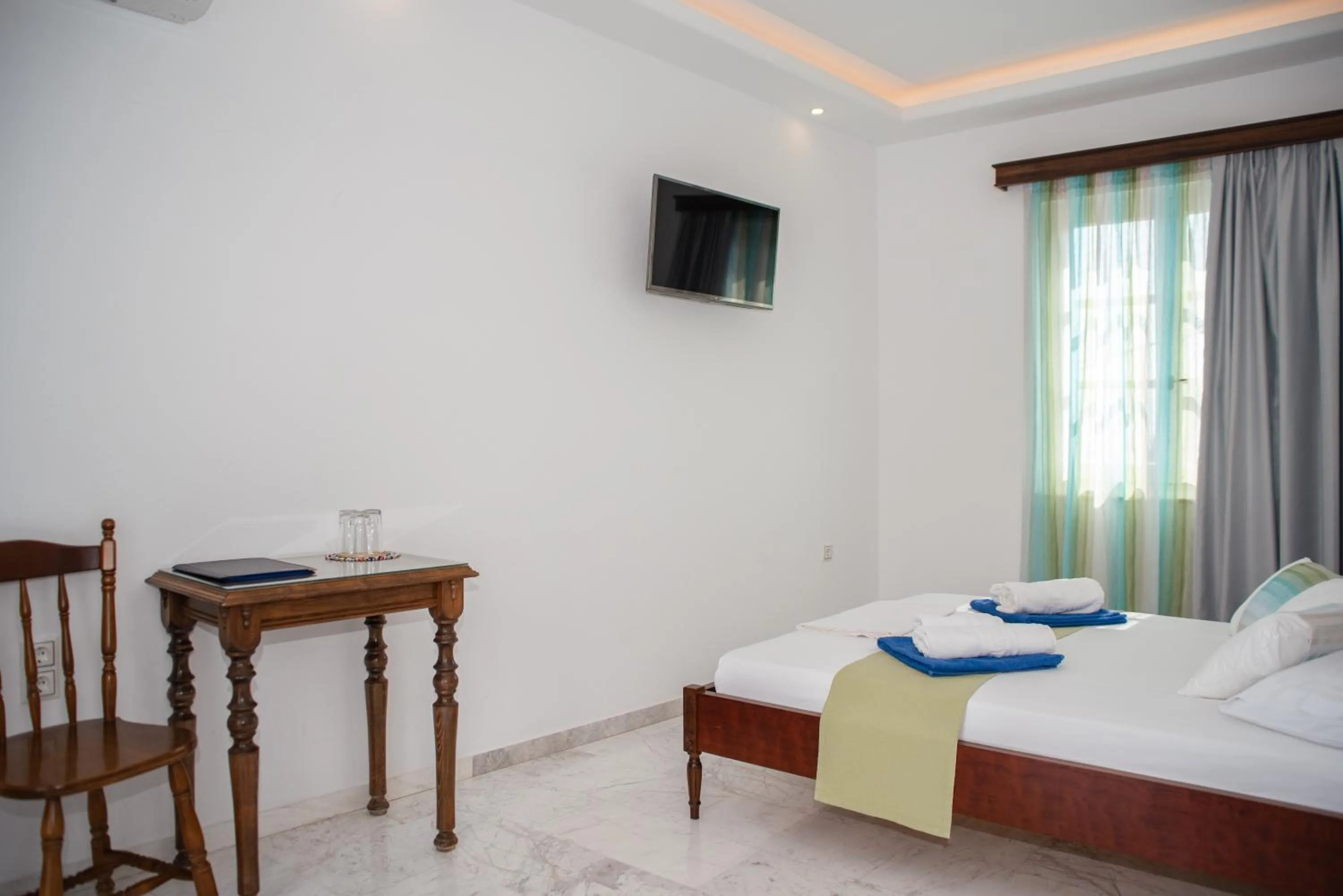 Bed in Adonis Hotel Naxos