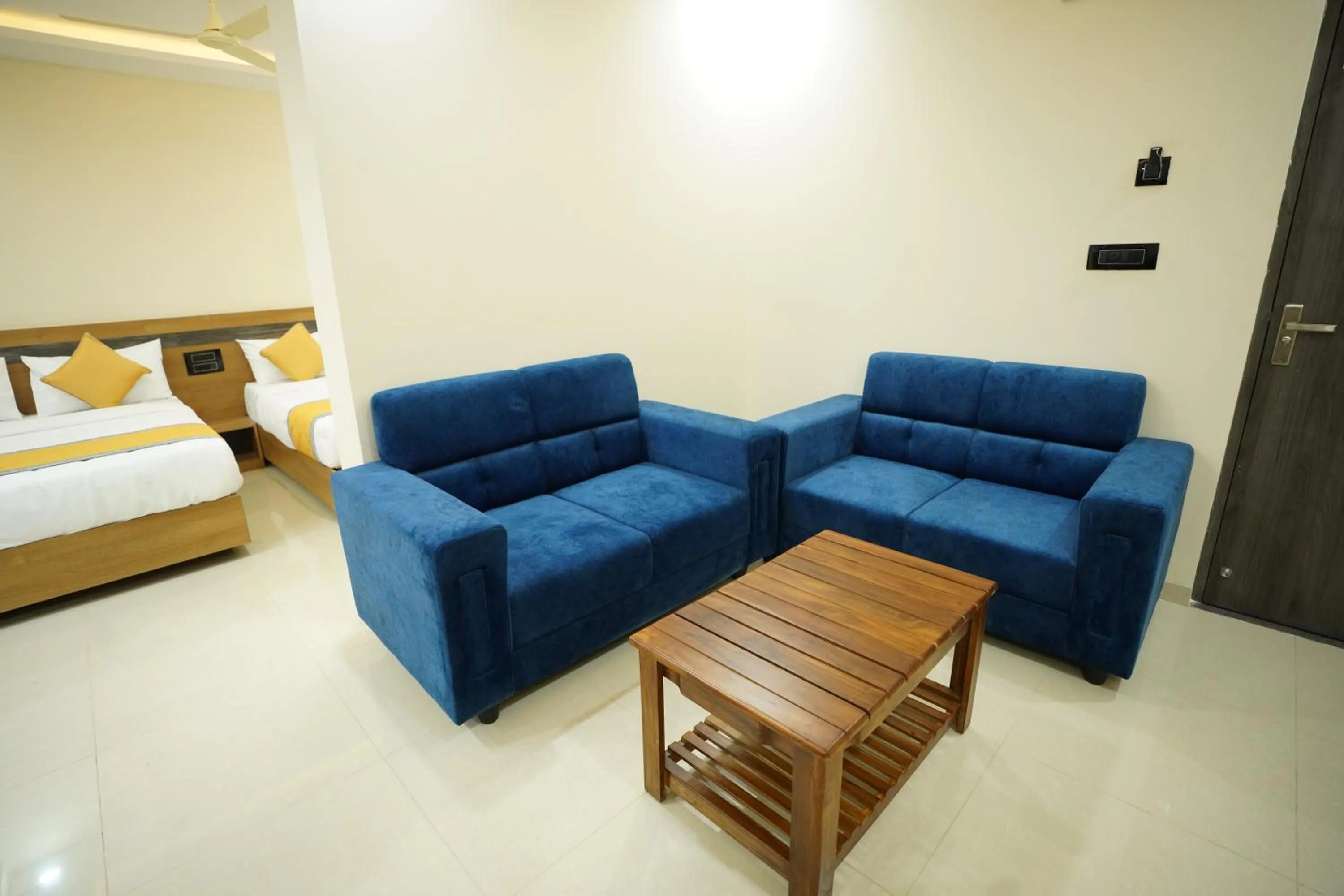 Living room, Bed in Hotel Mangalore Stay INN