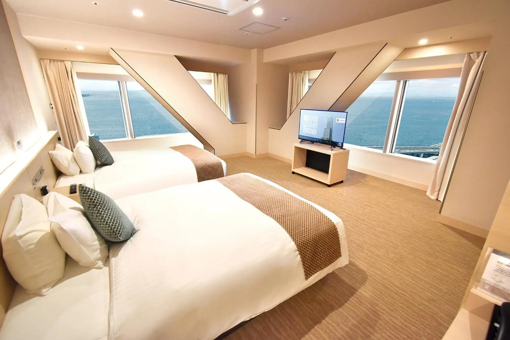 Deluxe Corner Triple Room with Bay View in Odysis Suites Osaka Airport Hotel Deluxe Corner Triple Room with Bay View in Odysis Suites Osaka Airport Hotel