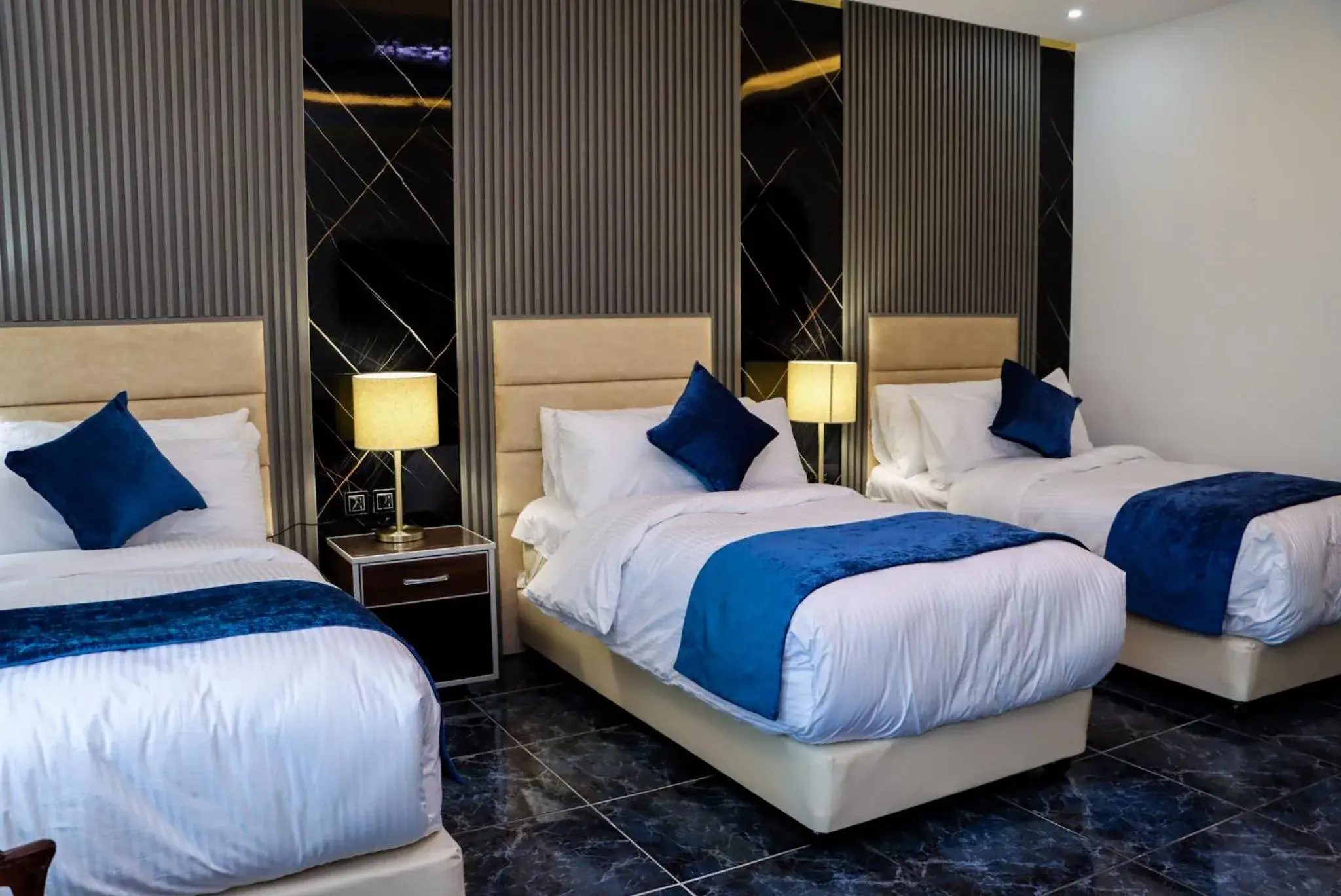 Deluxe Triple Room in The RN Hotels Deluxe Triple Room in The RN Hotels