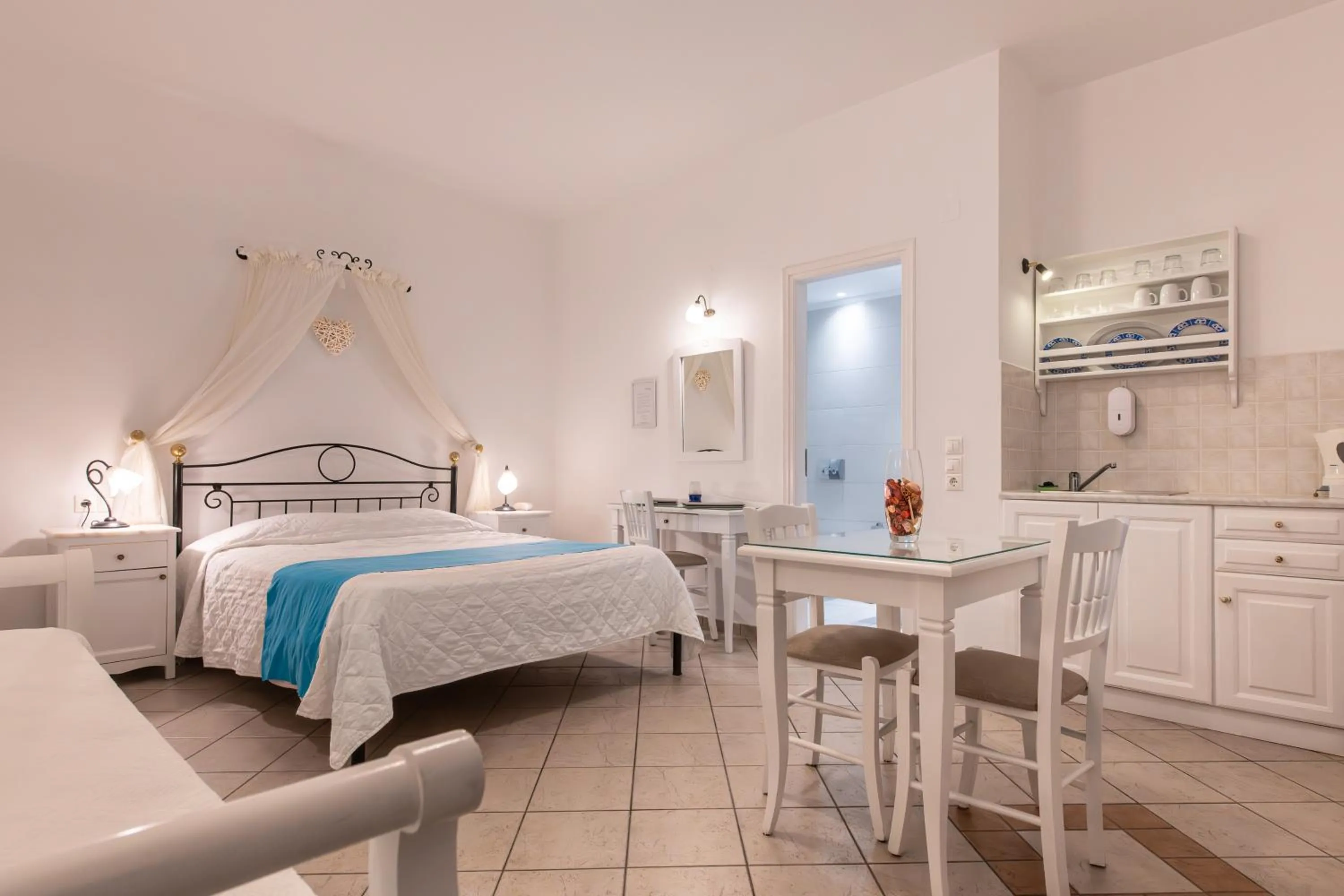 Photo of the whole room, Bed in Reverie Santorini Hotel