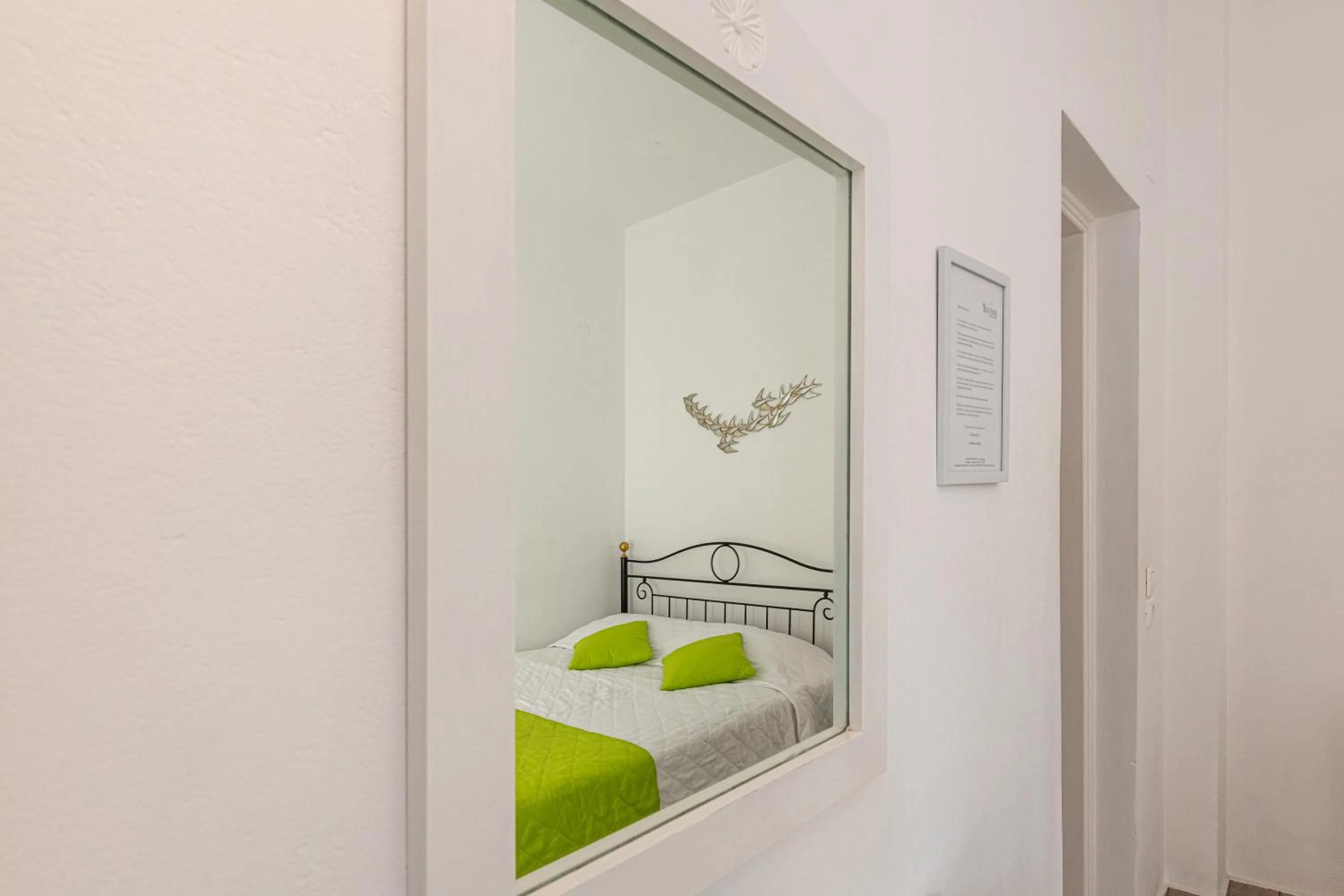 Bed in Reverie Santorini Hotel