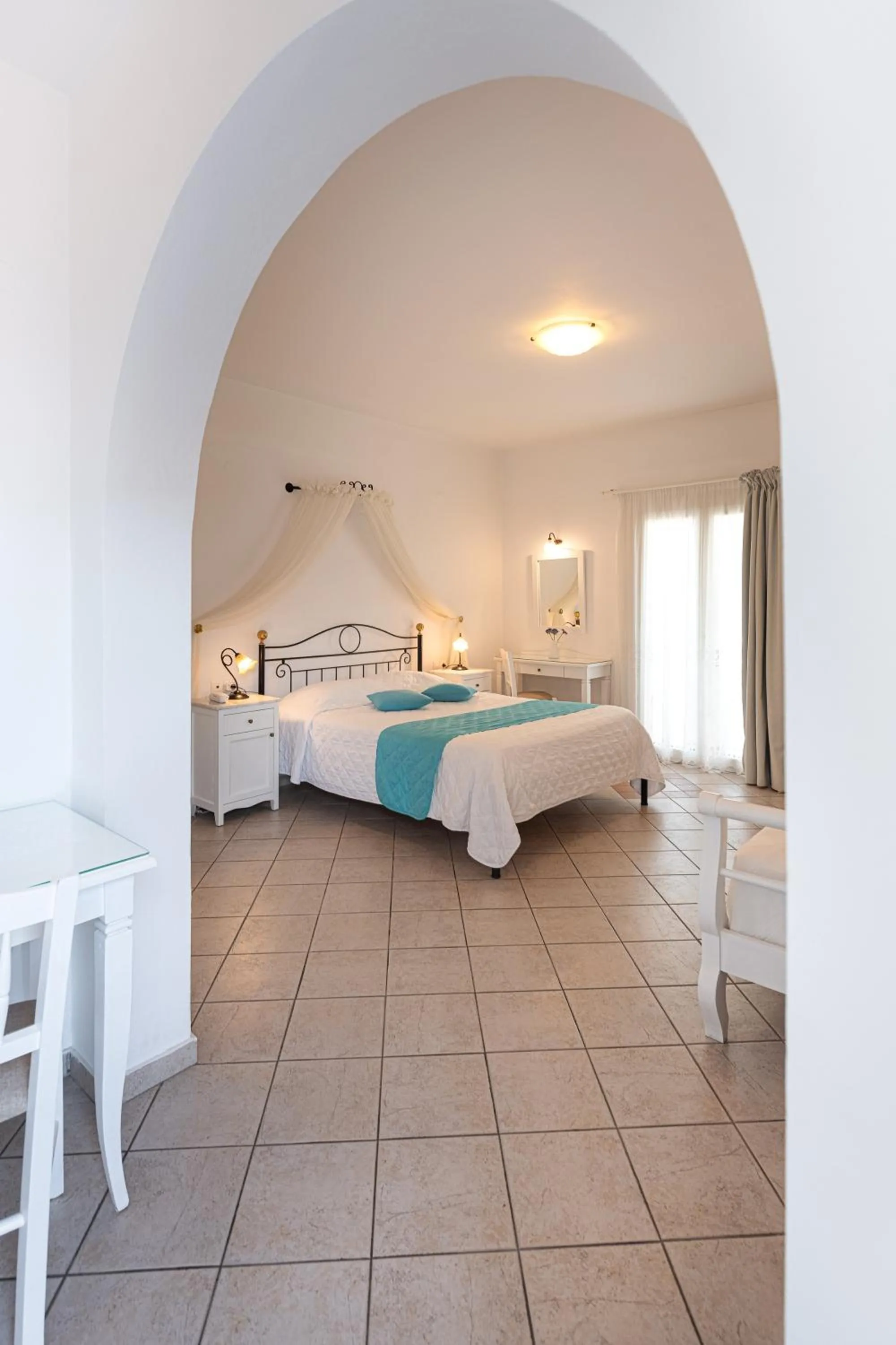 Bed in Reverie Santorini Hotel