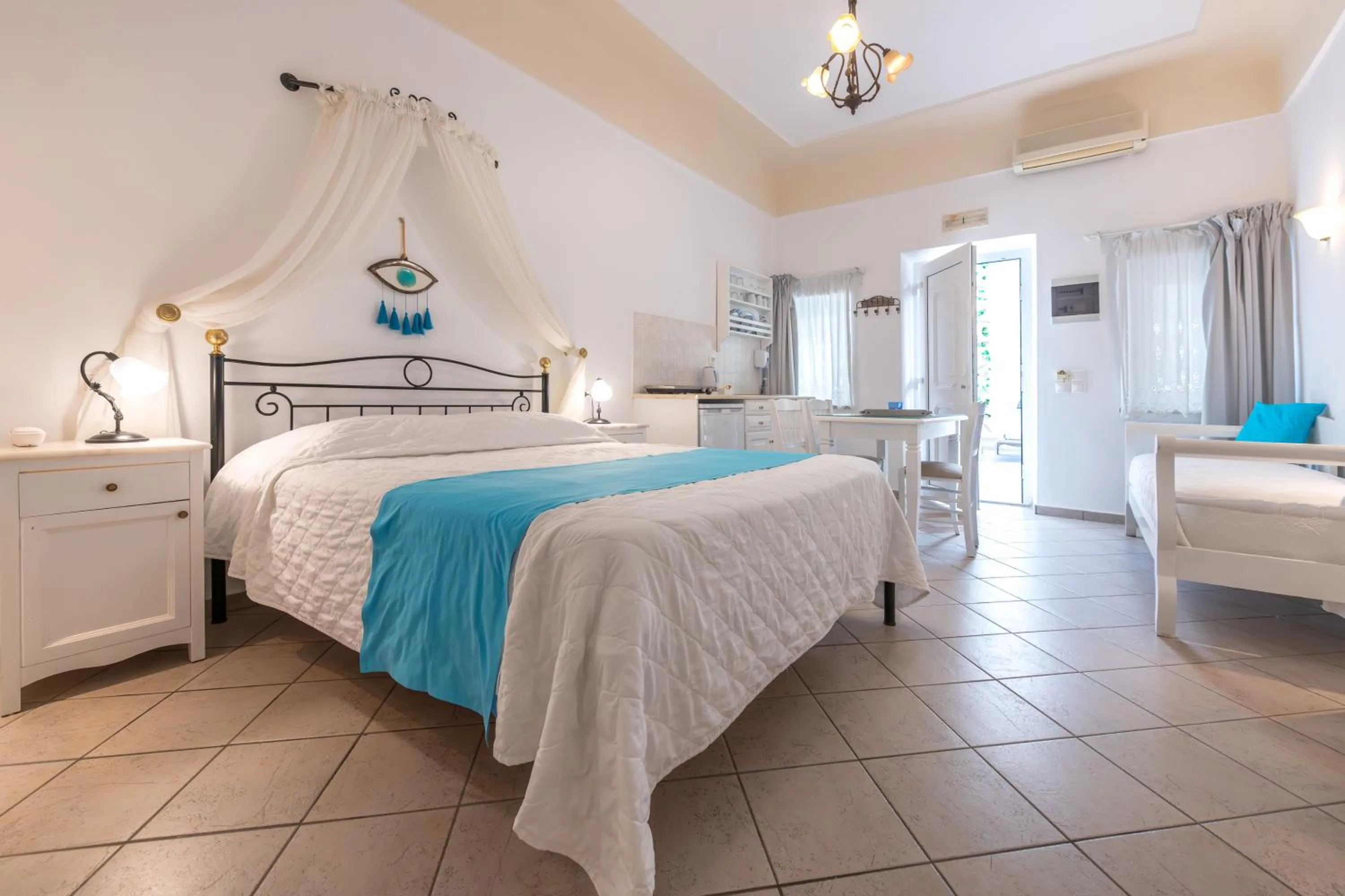 Photo of the whole room, Bed in Reverie Santorini Hotel