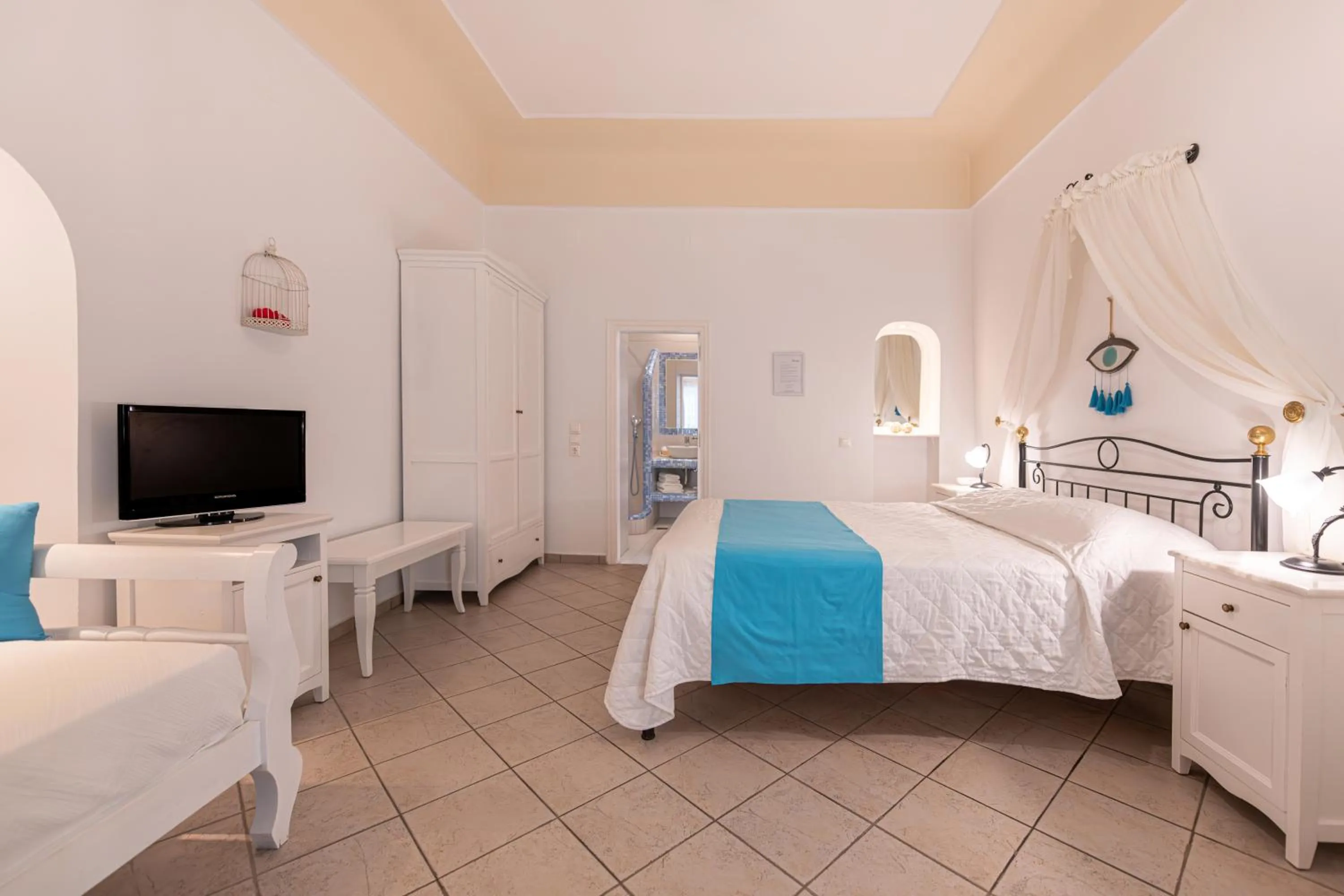 Photo of the whole room, Bed in Reverie Santorini Hotel