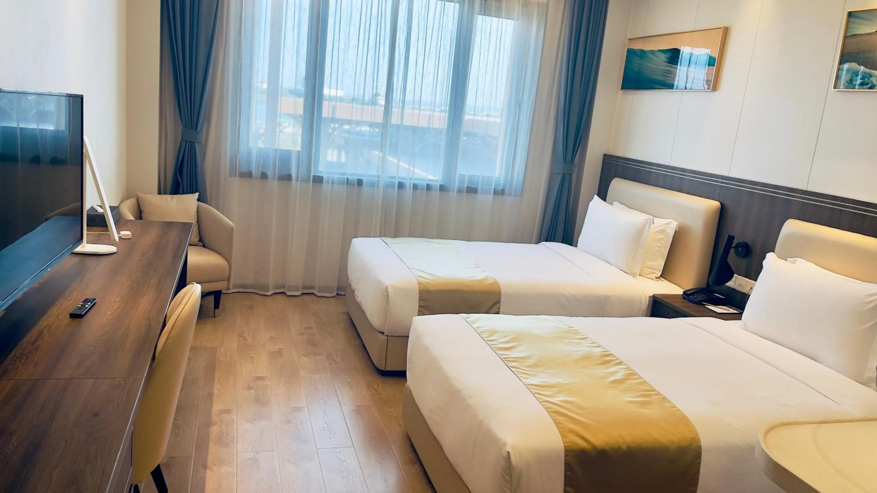 Bed in Escale International Hotel