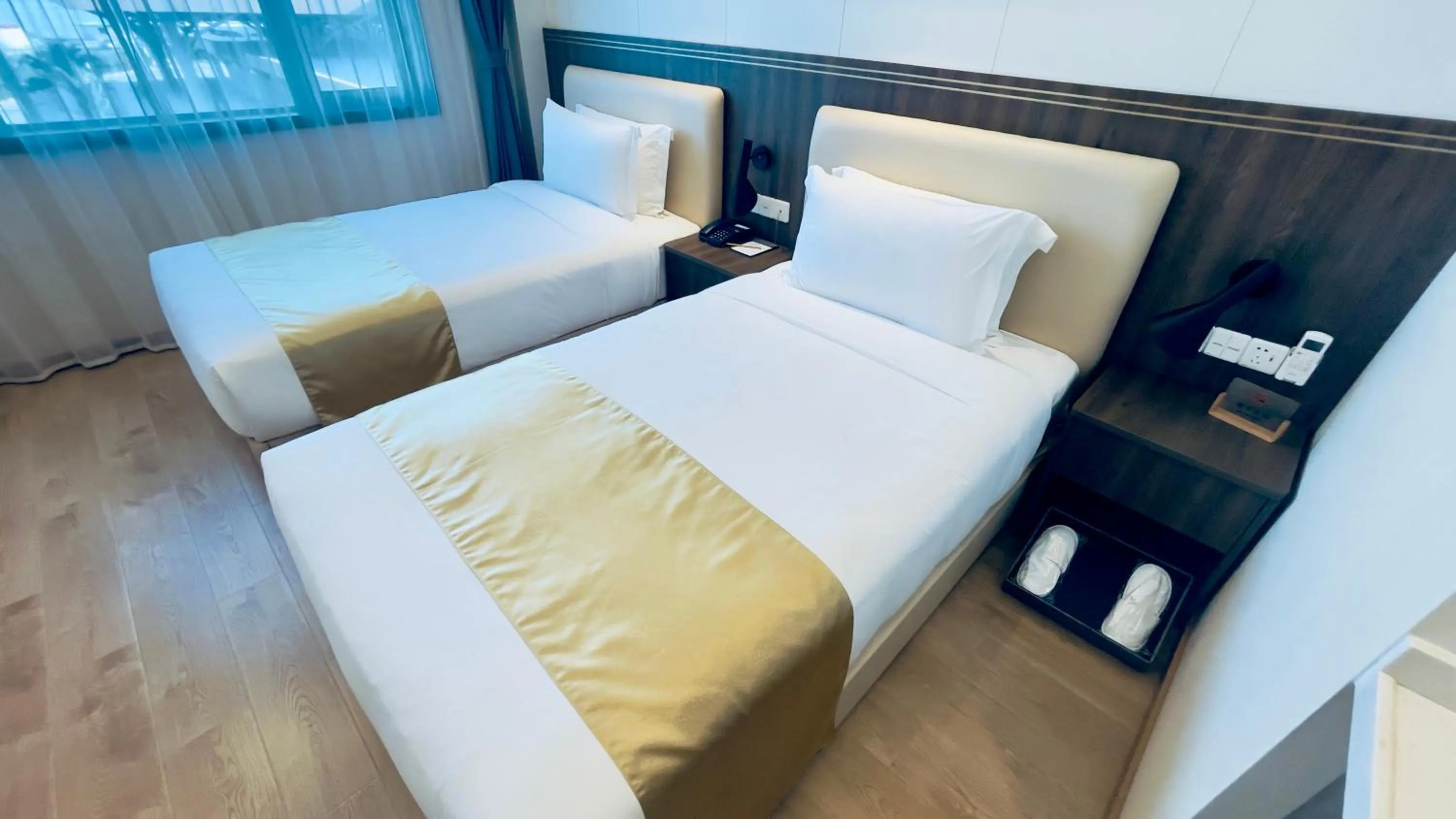 Bed in Escale International Hotel
