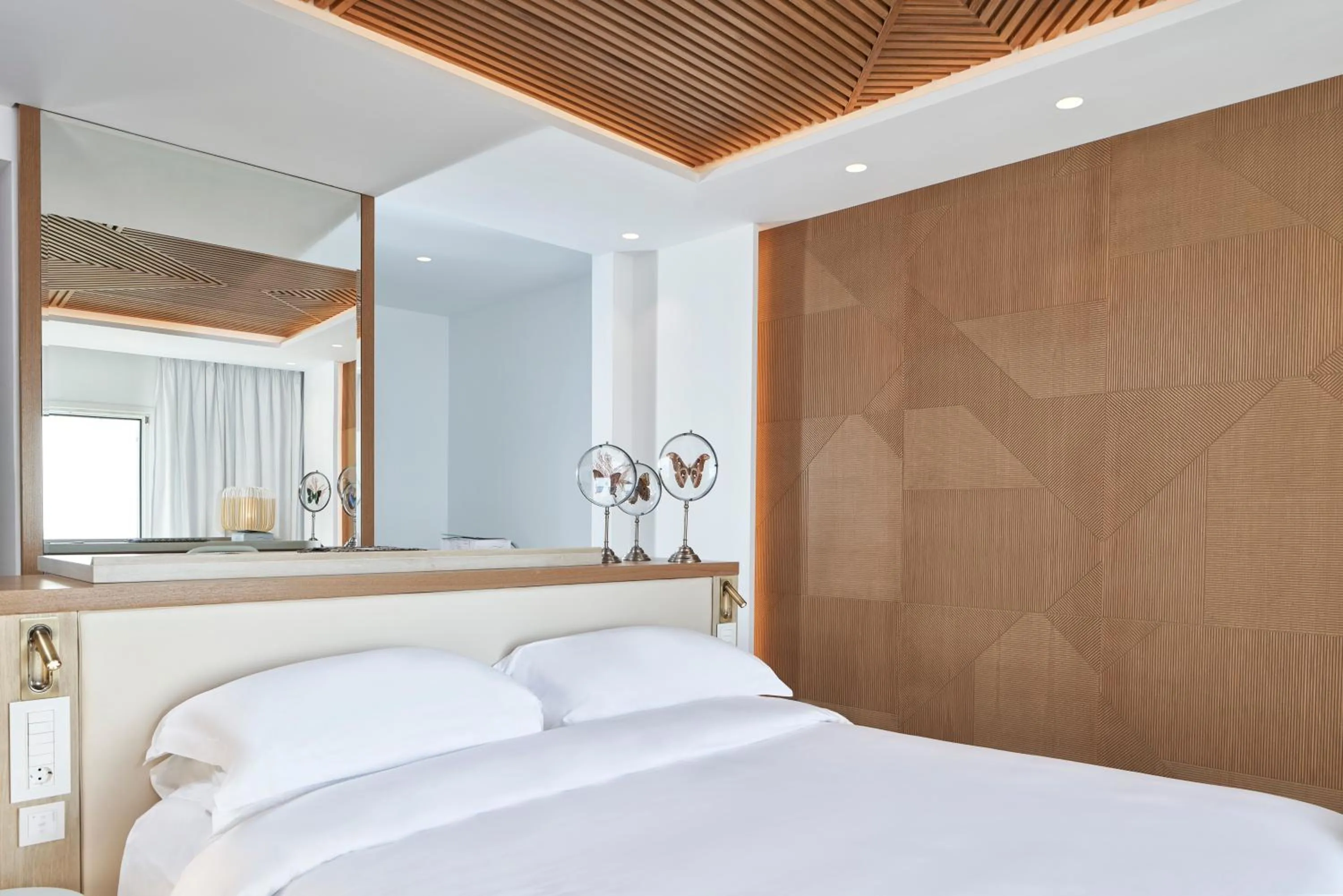 Bedroom in Myconian Korali Relais & Chateaux