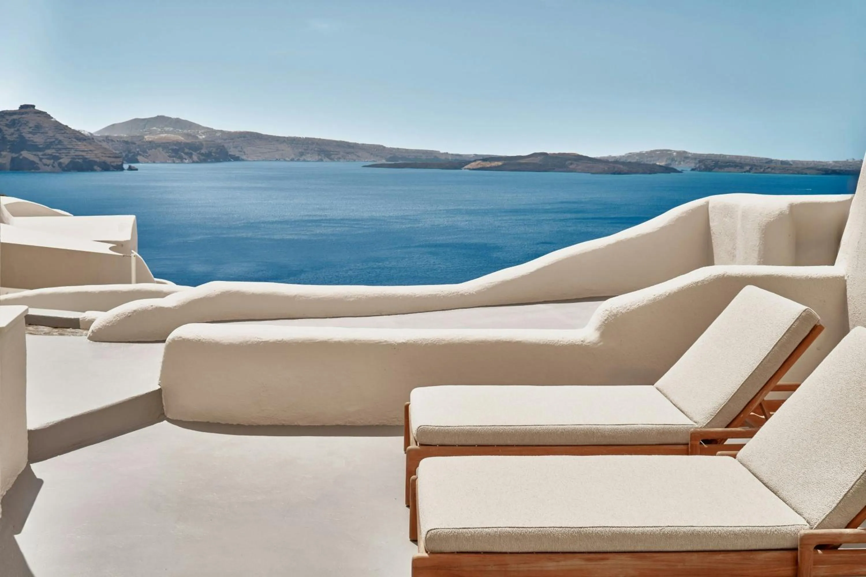 Photo of the whole room in Mystique, a Luxury Collection Hotel, Santorini