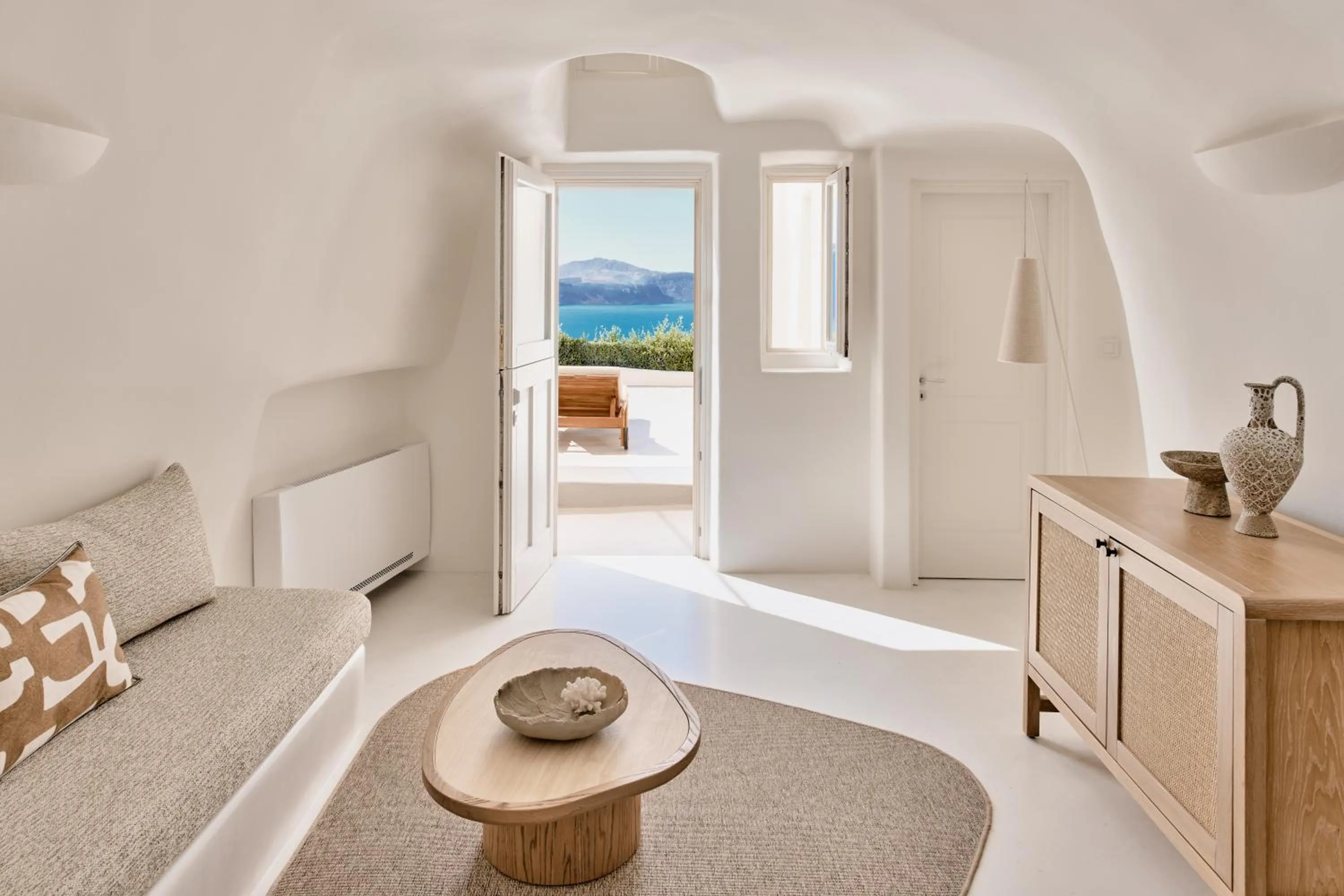 Living room, Bed in Mystique, a Luxury Collection Hotel, Santorini