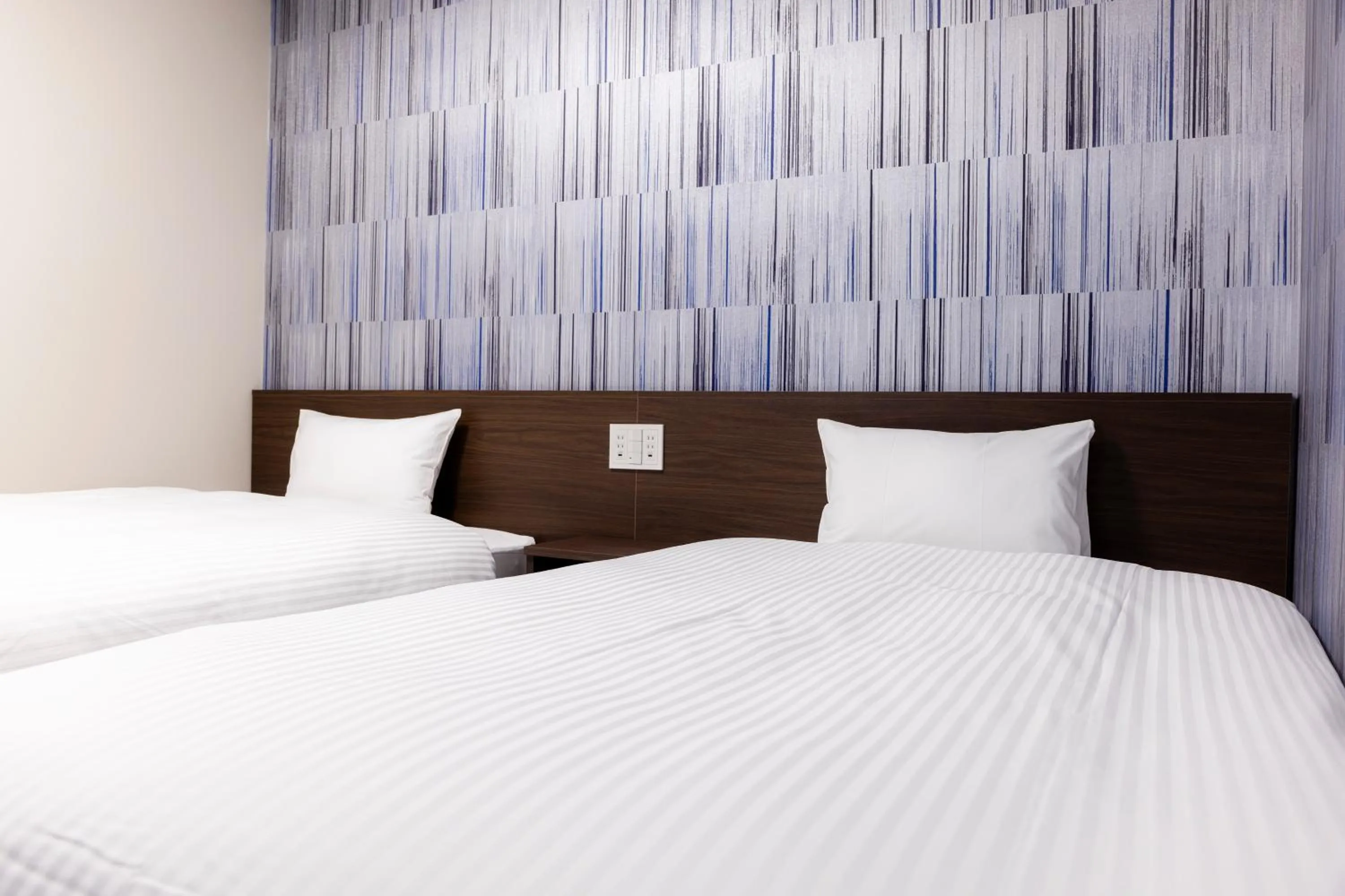 Bed in KOKO HOTEL Shizuoka - formerly Hotel Wing International Shizuoka