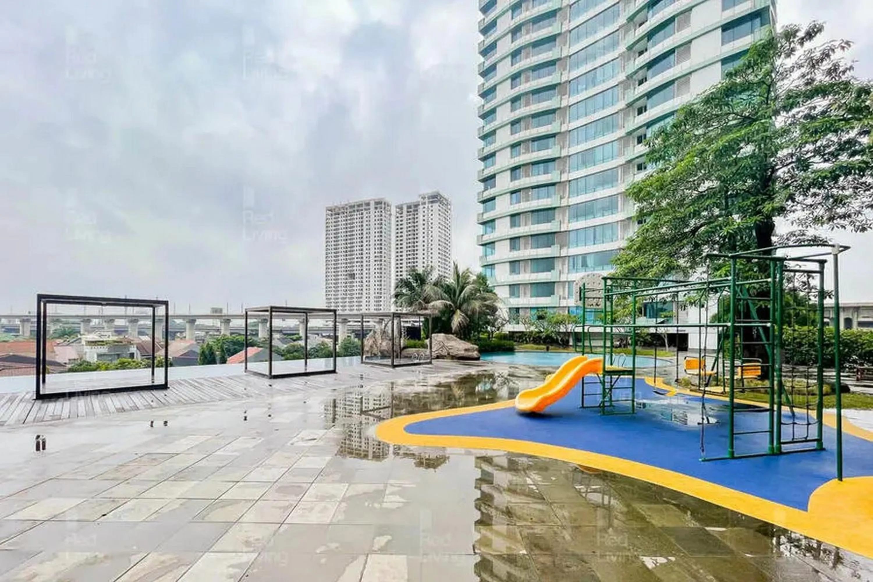 Children play ground in RedLiving Apartemen Grand Kamala Lagoon - Icha Rooms Tower Barclay South with Netflix