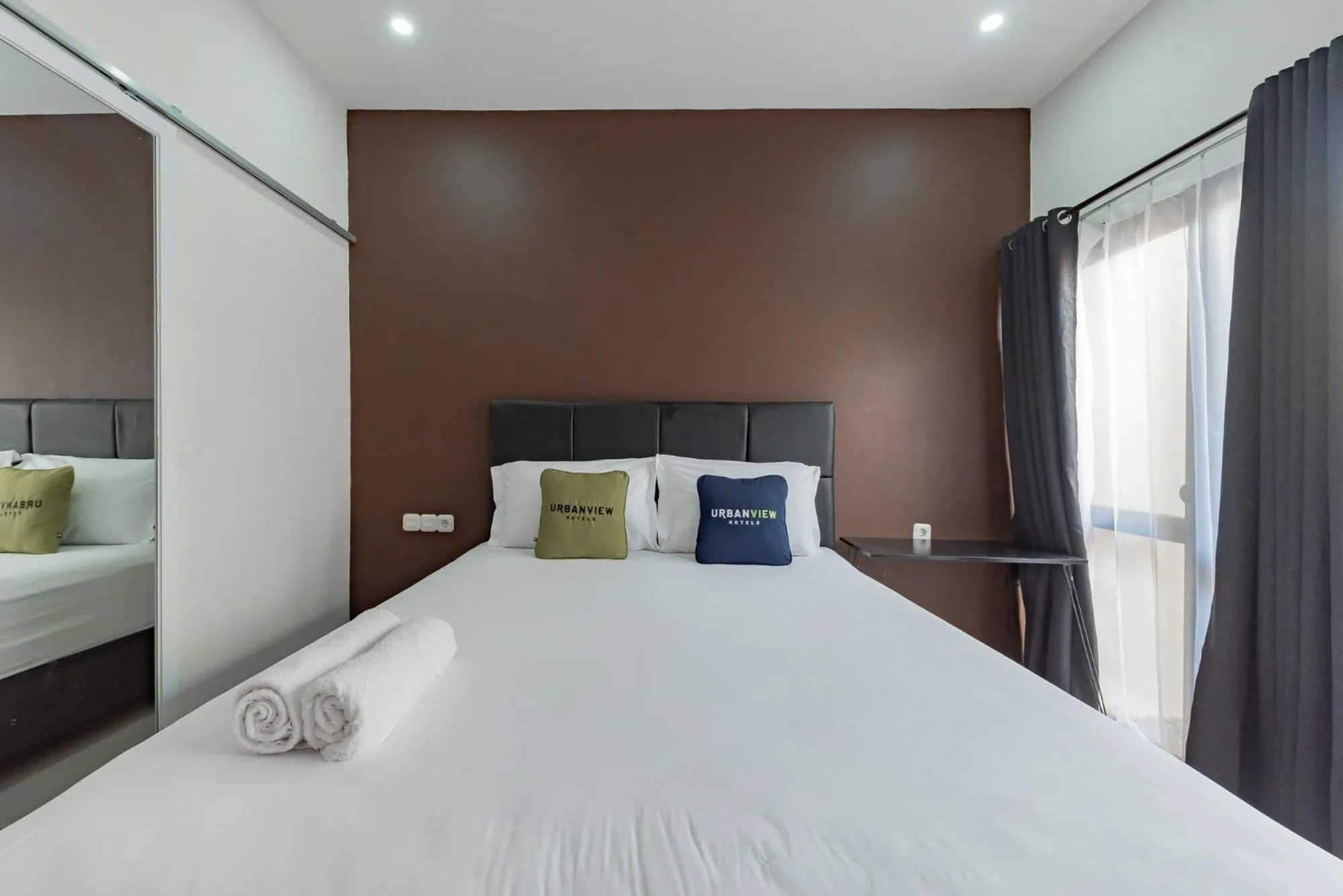 Bed in Urbanview Hotel Yoga Palangkaraya by RedDoorz