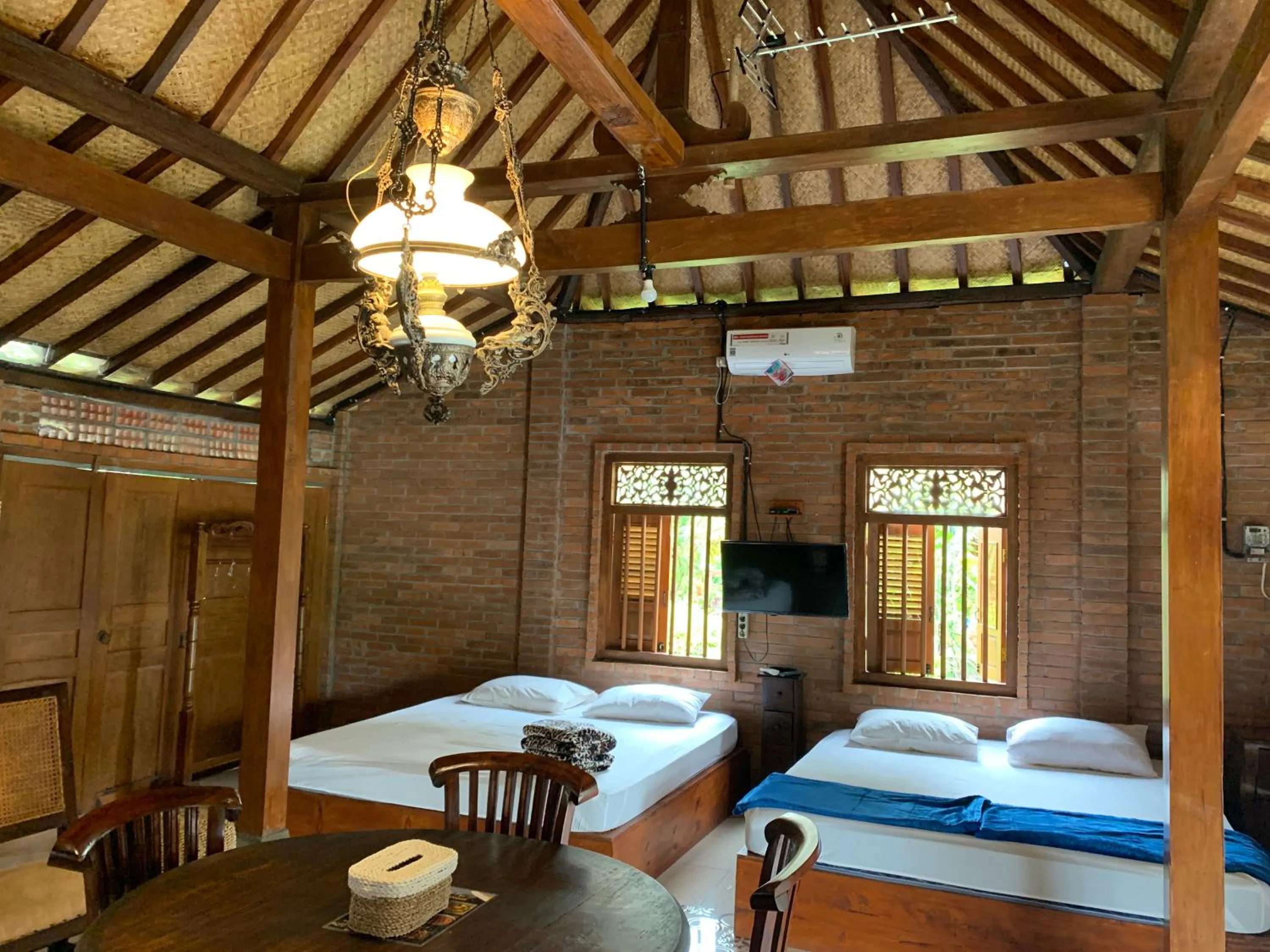 Bedroom in Omah Mbah Mandor by The Lavana