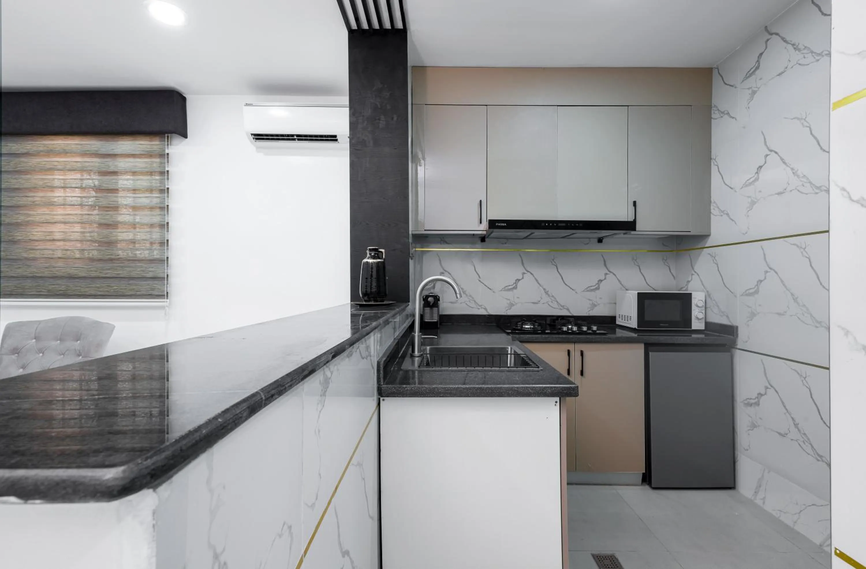 Kitchen or kitchenette in BKT Cribs - Apartments & Suites