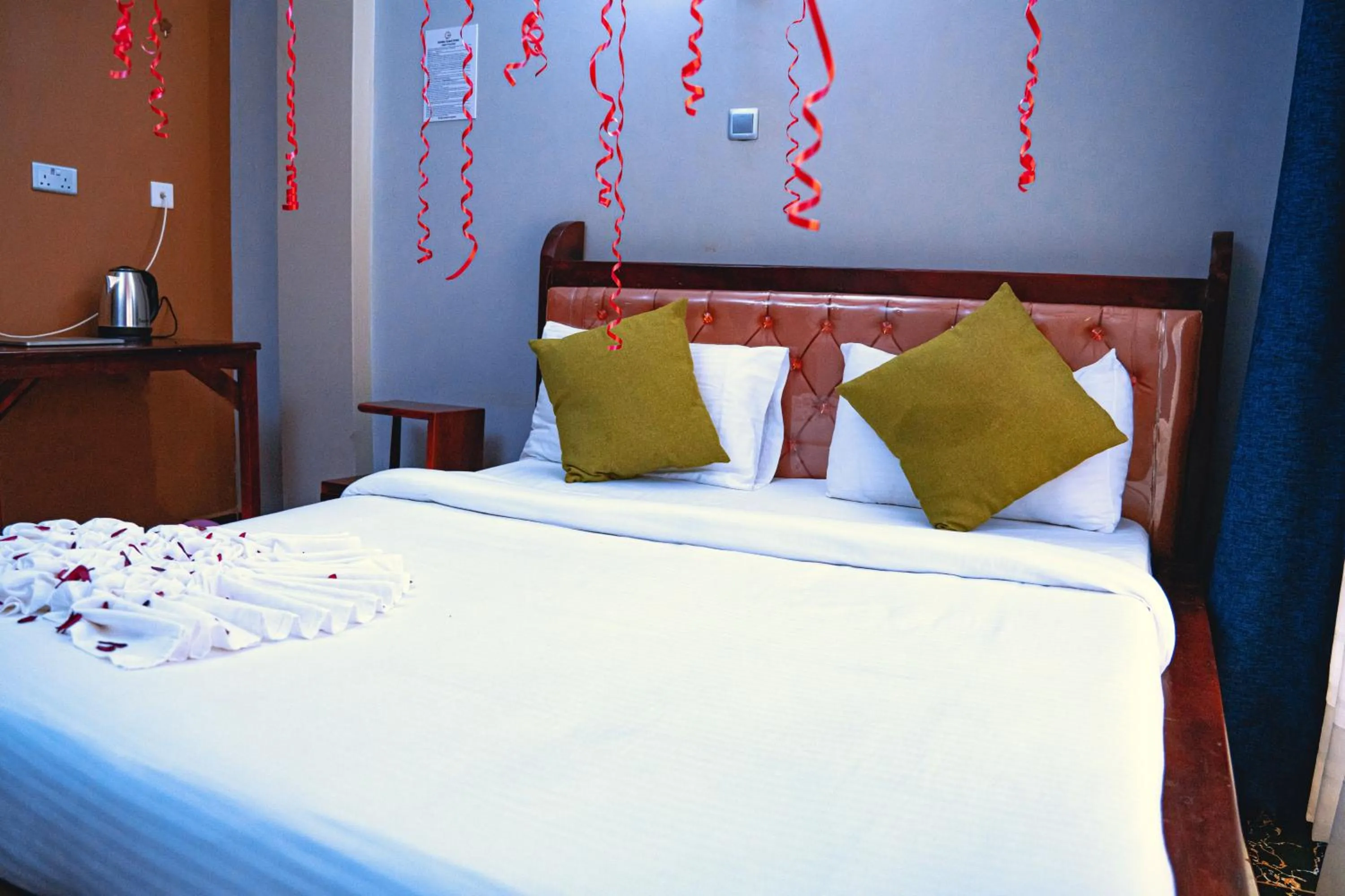 Bed in GOLDEN QUEST HOTEL