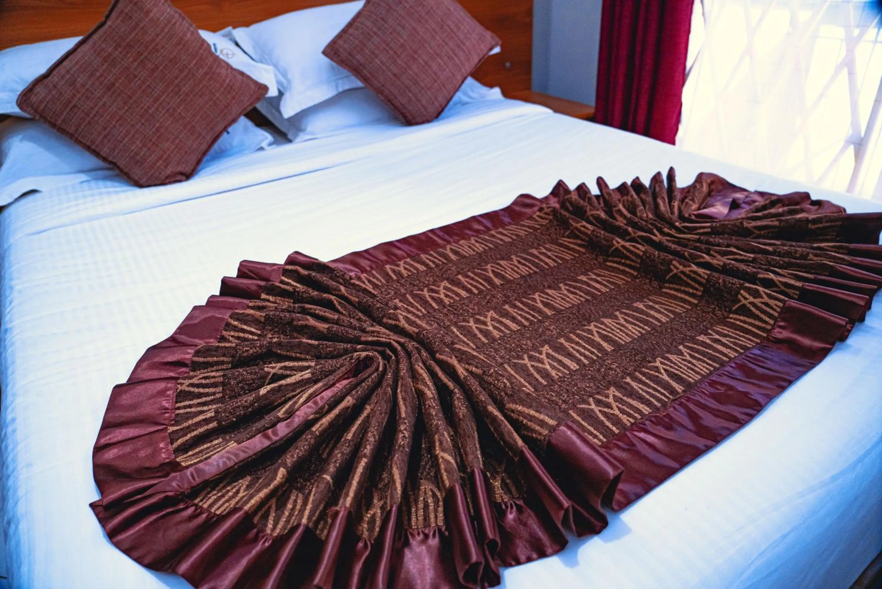 Bed in GOLDEN QUEST HOTEL