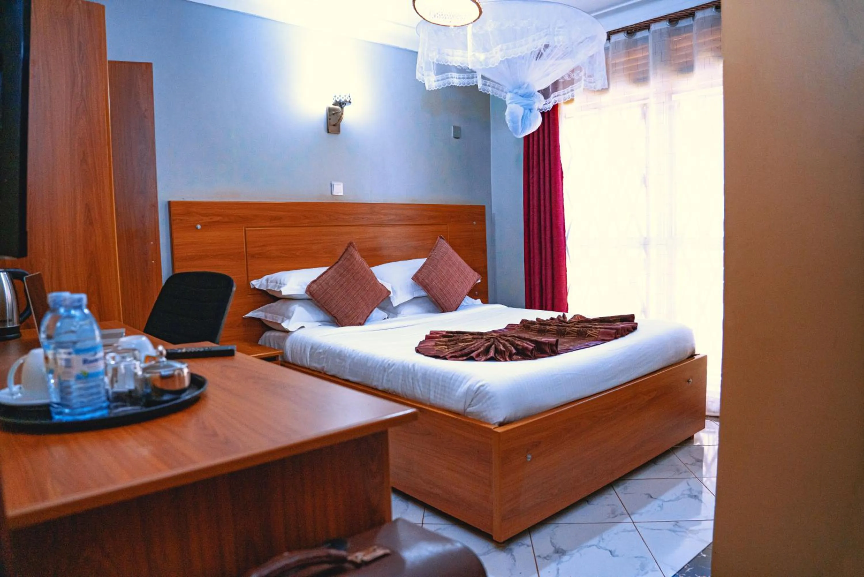 Bed in GOLDEN QUEST HOTEL