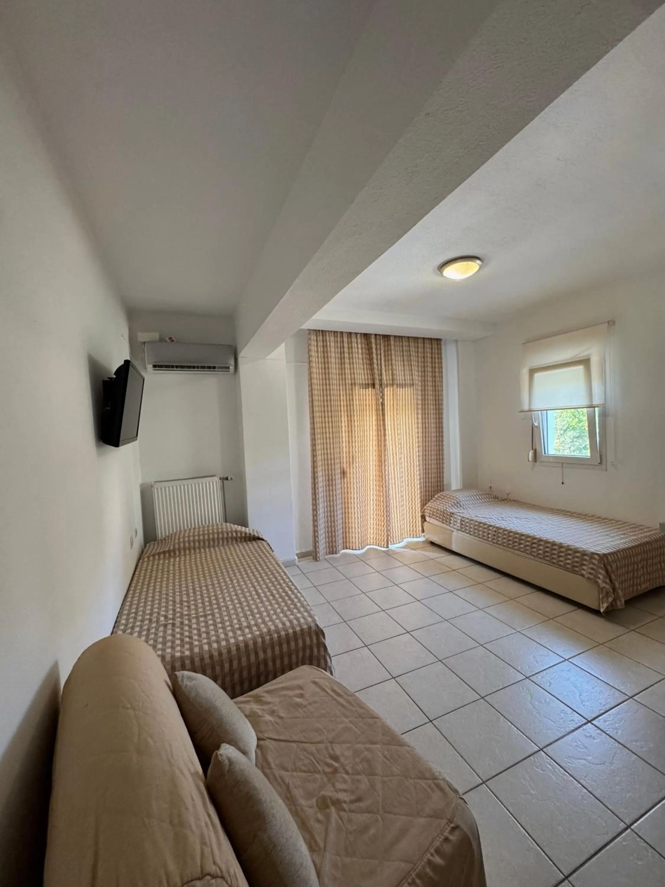 Bed in Milos Apartments