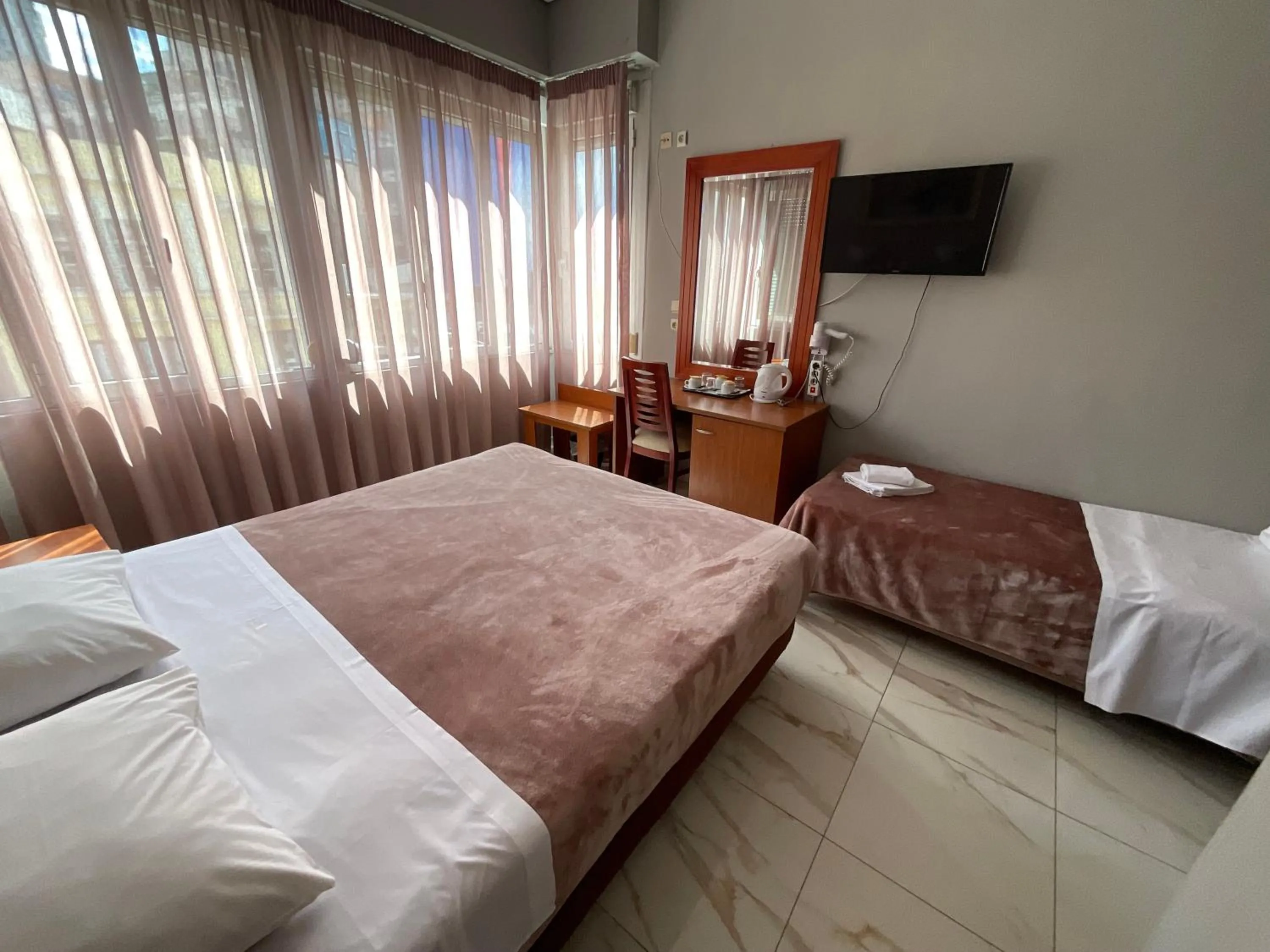 Bed in Piraeus Acropole Hotel