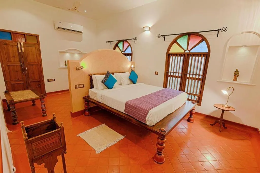 Bed in Marari Beach Bungalow Resort Alleppey