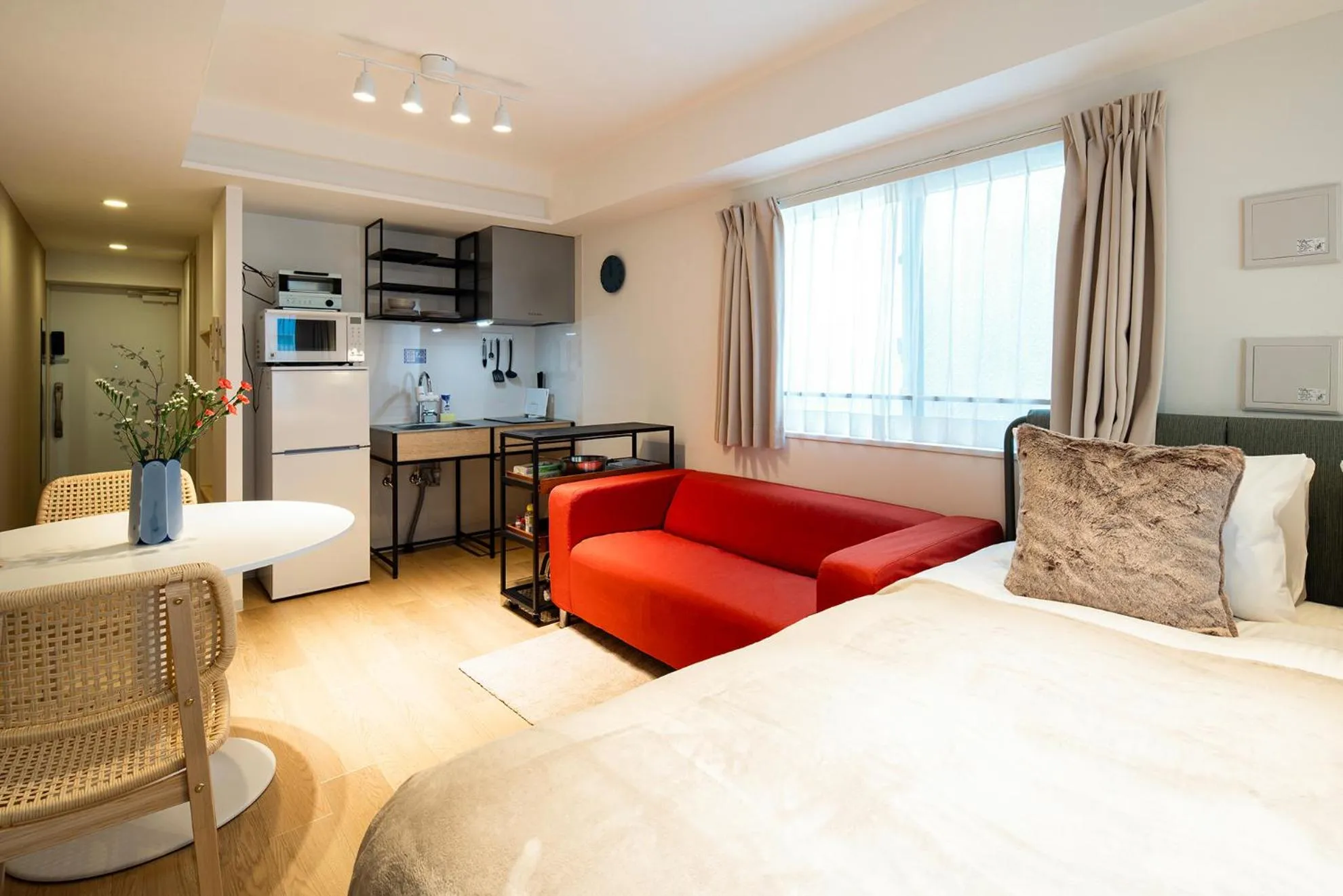Dining area, Bed in Section L Residence Ginza