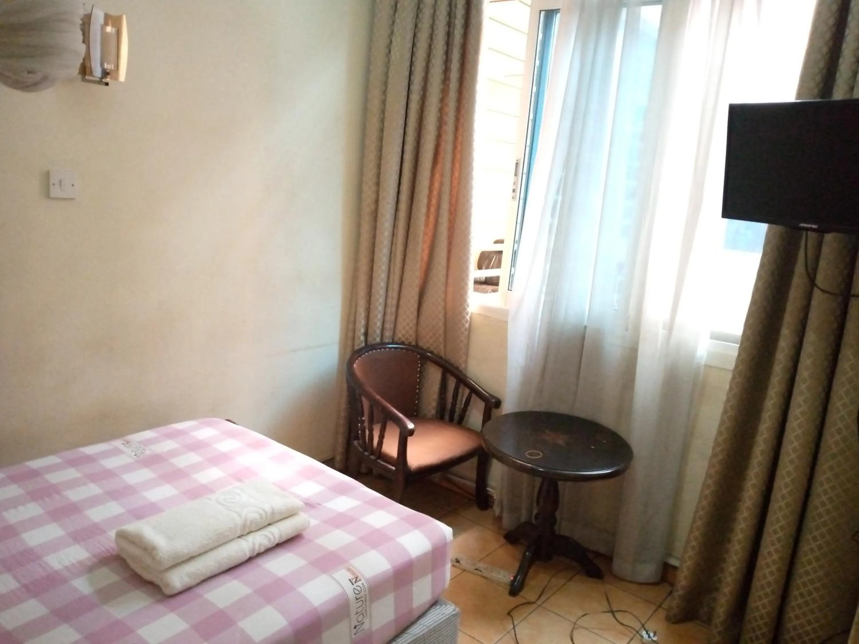 Bed in DOUBLE FIVE HOTEL